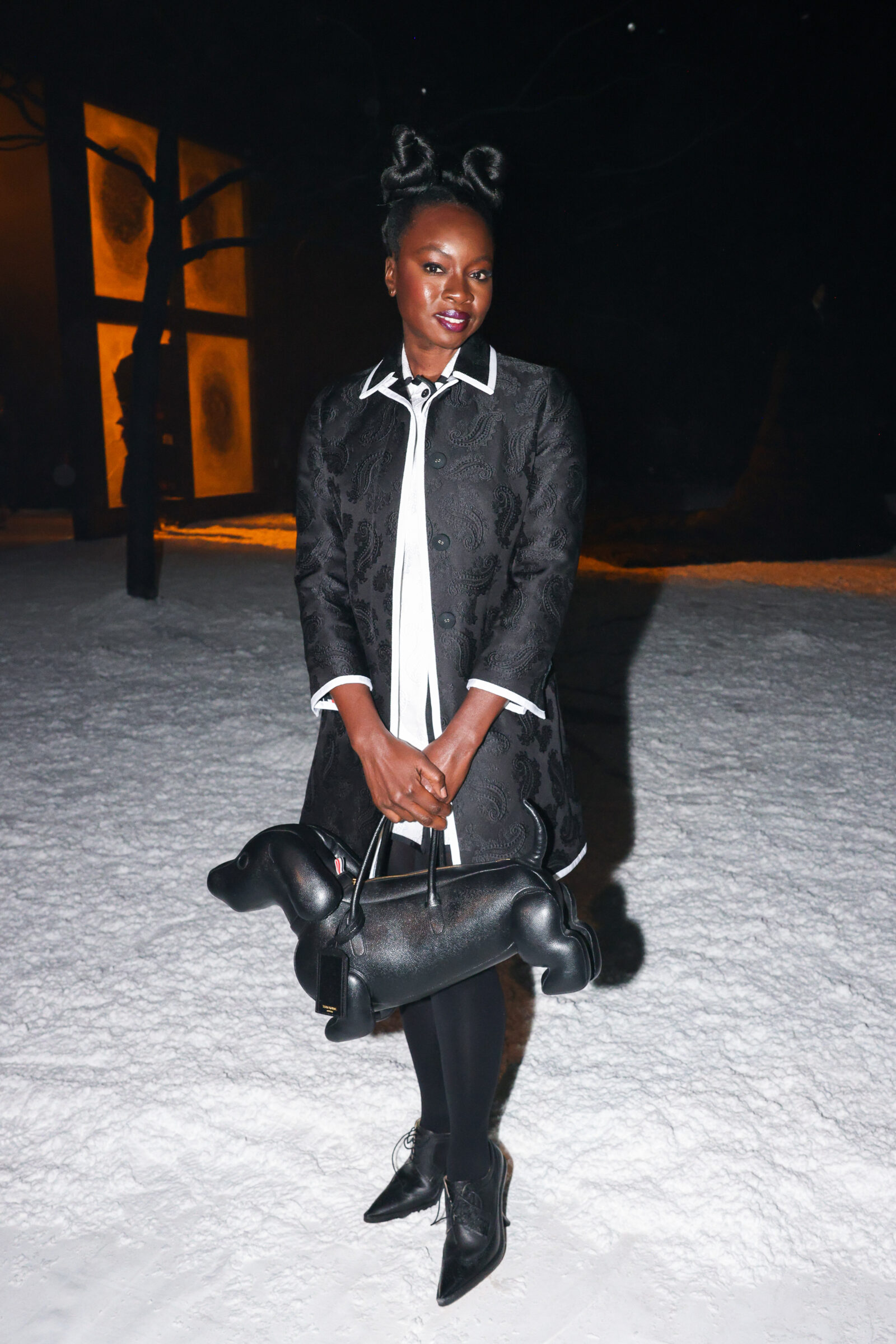 Danai Gurira attends the snowy Thom Browne FW24 show wearing Thom Browne in New York. (Image courtesy of Thom Browne)