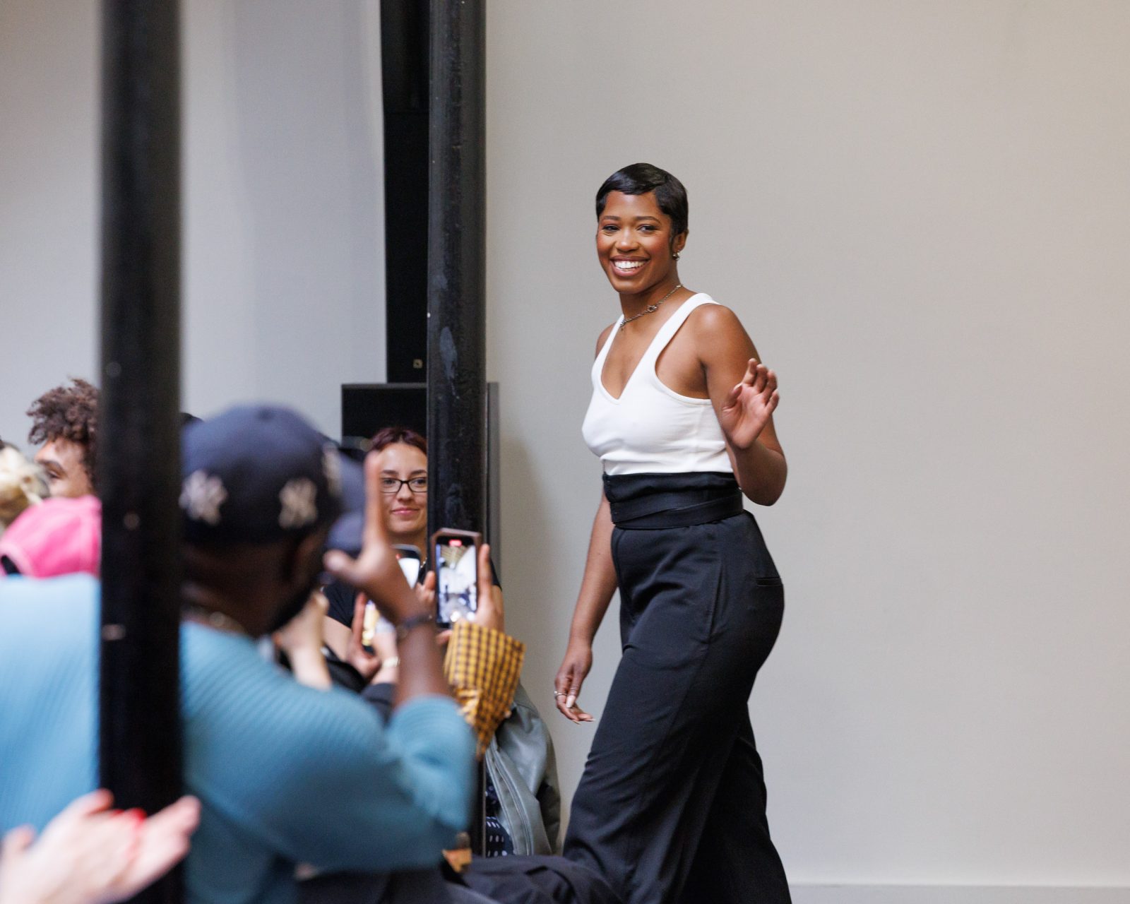 Bianca Saunders waves to the audience at her Spring Summer 2025 show in Paris.
