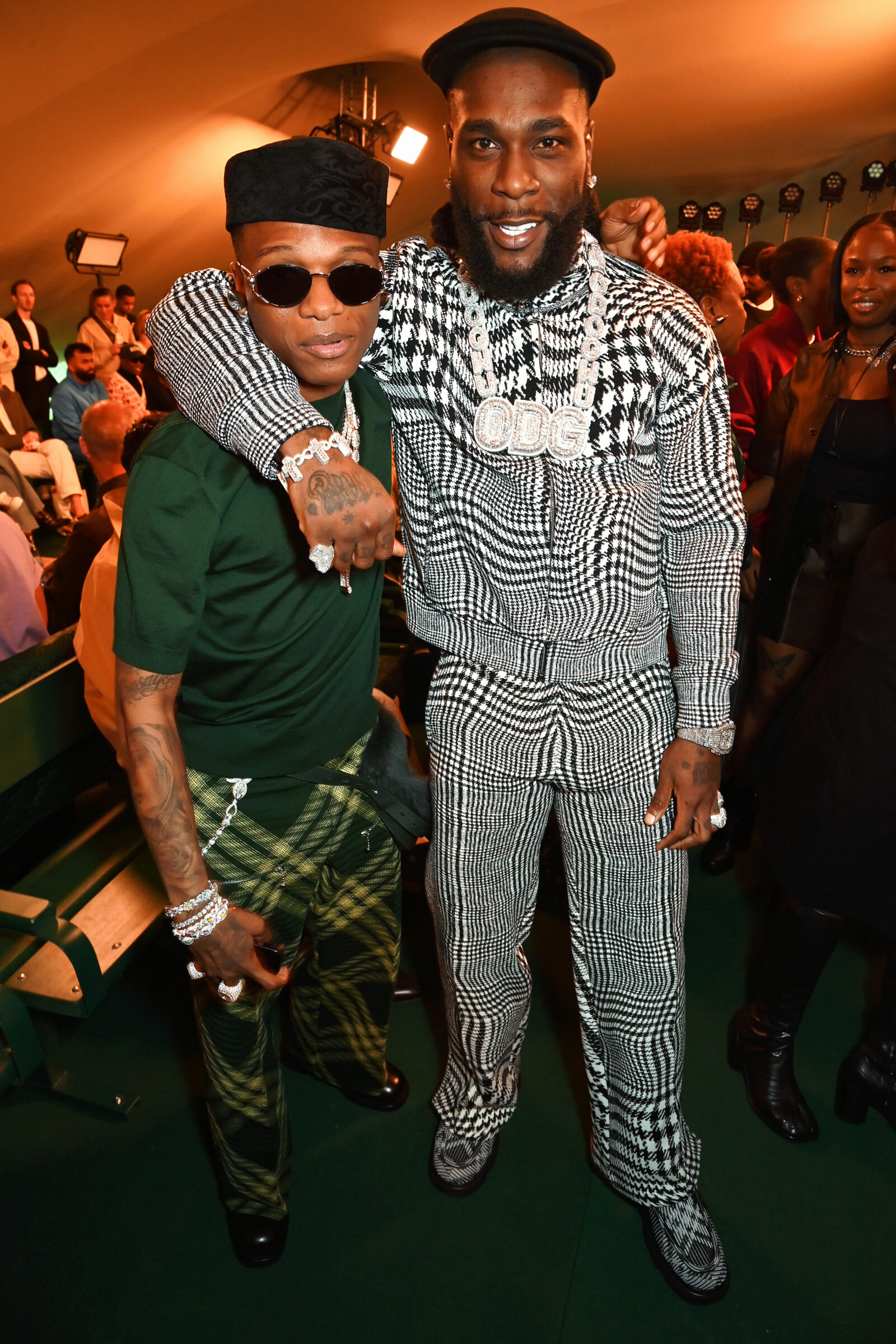 Wizkid and Burna Boy attend the Burberry Spring Summer 2024 show during London Fashion Week on September 18, 2023 in London, England. Photo by Dave Benett
