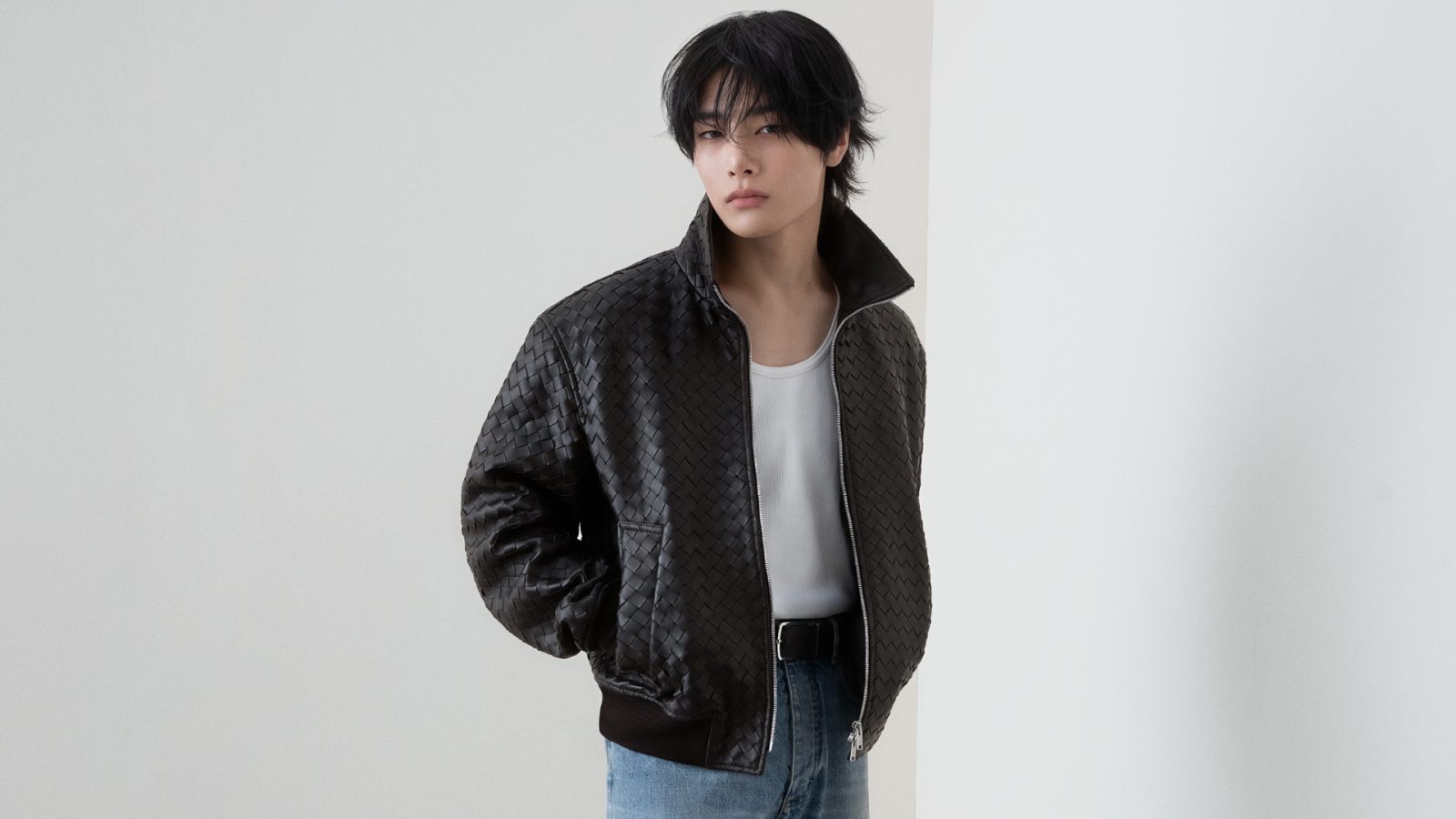 I.N of Stray Kids joins the iconic Italian luxury house. Here we wears an intrecciato leather bomber jacket from the house's latest collection. (Image: Courtesy of Bottega Veneta)
