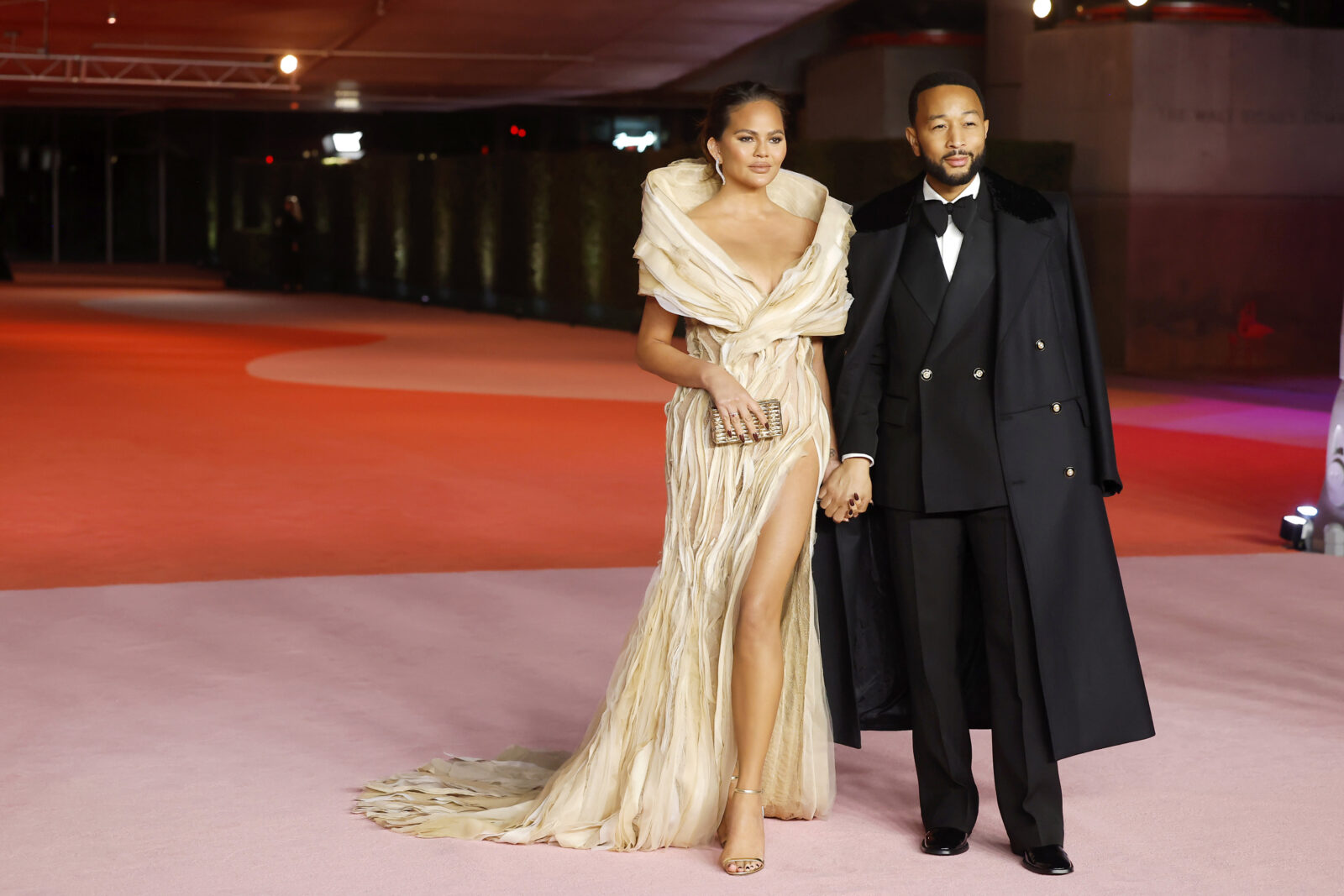Chrissy Teigen graces the red carpet in a Tony Ward Couture gown alongside her husband John Legend at the Academy Museum of Motion Pictures Gala. (Photo credit: Emma McIntyre/Getty Images, courtesy of Tony Ward)