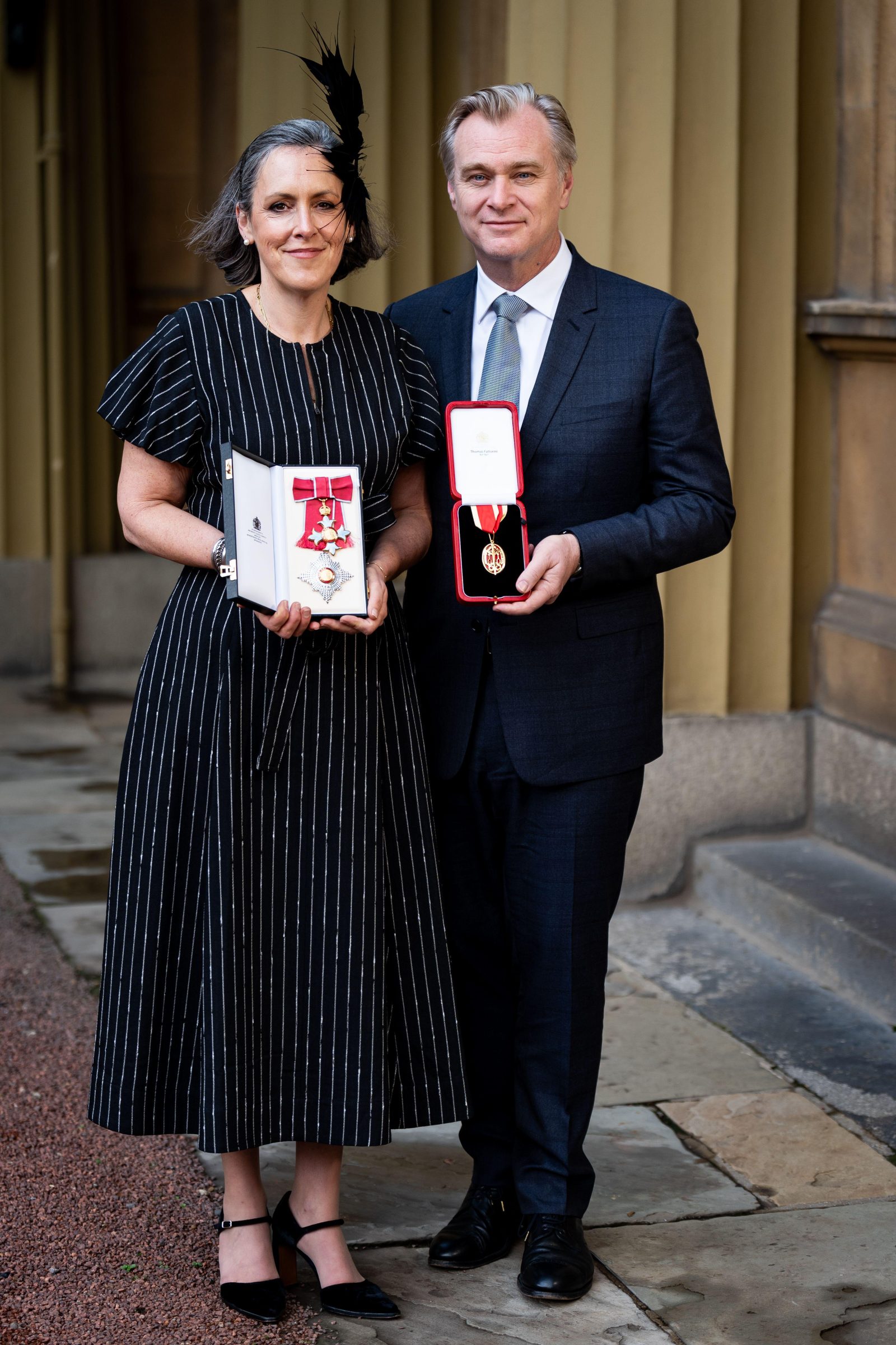 Emma Thomas and Christopher Nolan after being made a Dame Commander of the British Empire and a Knight Bachelor at an Investiture ceremony at Buckingham Palace in London. (Photo: Courtesy of Dior)