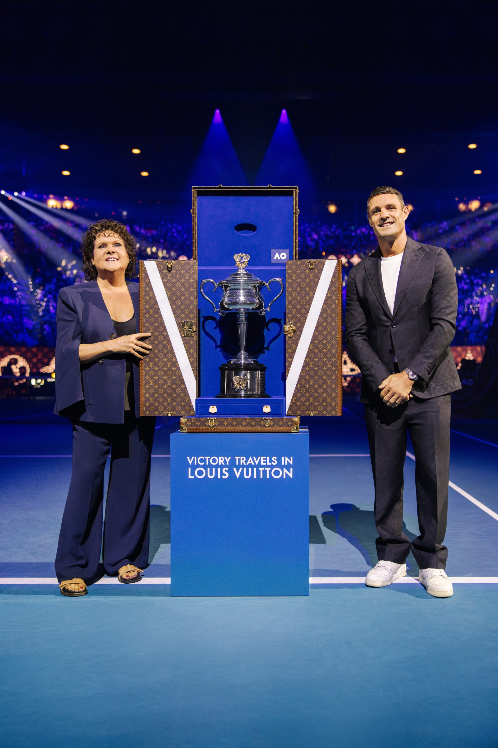 Tennis legend Evonne Goolagong Cawley and Louis Vuitton House Ambassador Dan Carter present the Daphne Akhurst Memorial Cup in its custom Louis Vuitton trunk at the 2025 Australian Open Women's Final (Photo: Courtesy of Louis Vuitton)