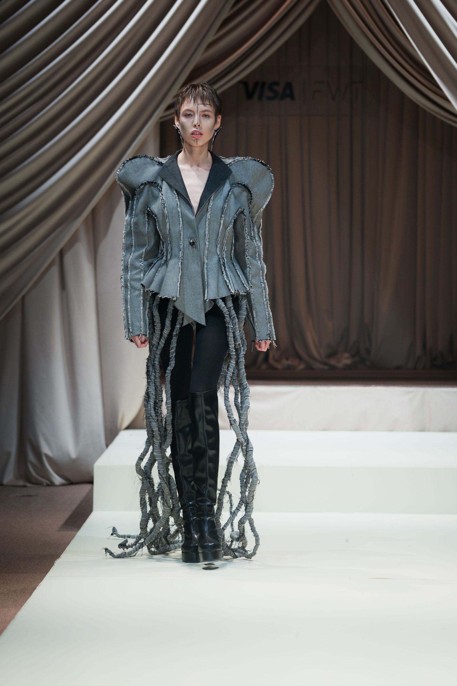 A tailored jacket recalling courtly silhouettes combined with avant-garde detailing and materials as seen in Dark'N'Core's latest collection revealed at Tashkent Fashion Week. (Photo: Courtesy of Timur Epov)