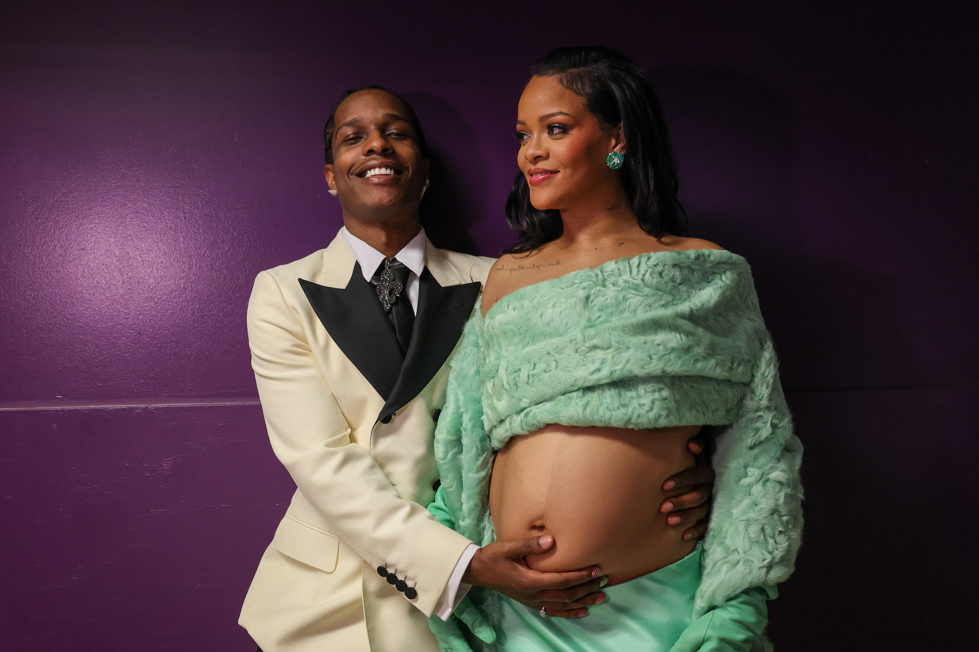 ASAP Rocky, Rihanna wears a Bottega Veneta siren green silk bustier and skirt, shearling stole set and leather gloves.
