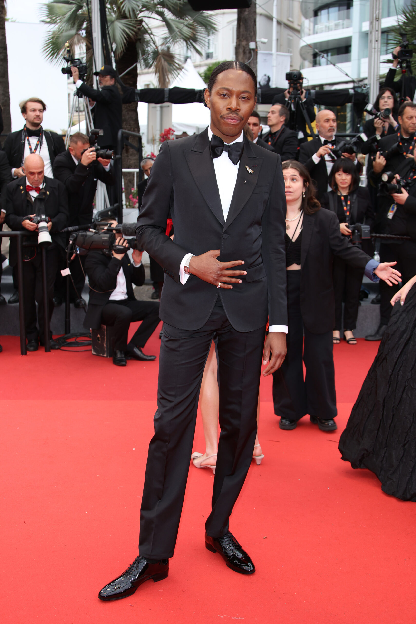 Jeremy O'Harris wore a Gucci black single-breasted tuxedo, black bow-tie, and black lace-up shoes. Image courtesy of Gucci.