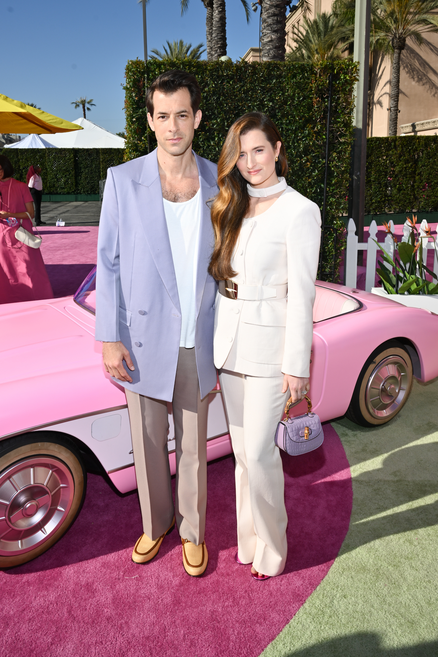 MARK RONSON wore a GUCCI Fall/winter 2023 jacket, pants and t-shirt and loafers with Horsebit detail. GRACE GUMMER wore a GUCCI jacket, pants and belt and a Gucci Bamboo 1947 handbag. MARK RONSON wore a GUCCI Fall/winter 2023 jacket, pants and t-shirt and loafers with Horsebit detail. GRACE GUMMER wore a GUCCI jacket, pants and belt and a Gucci Bamboo 1947 handbag.