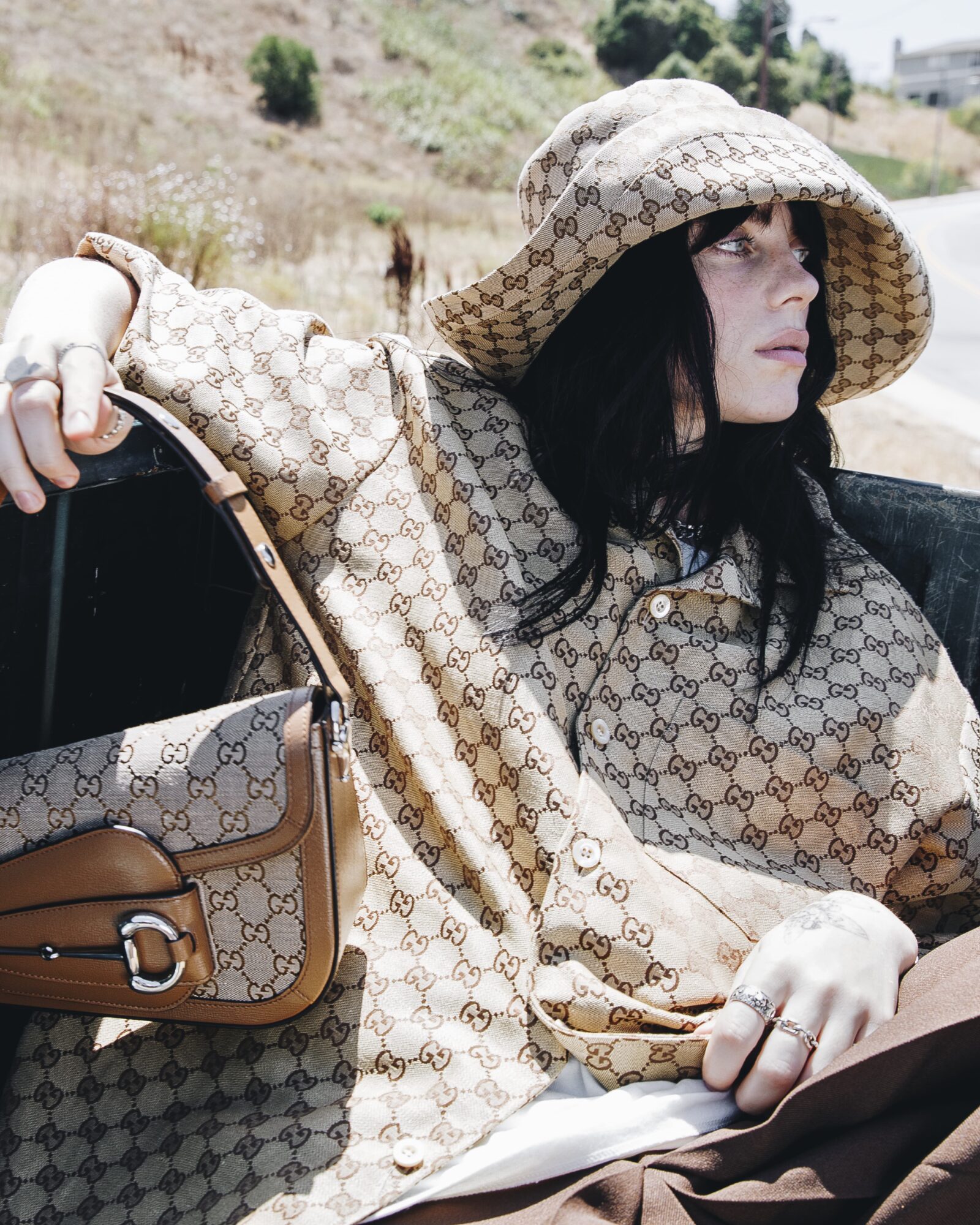 Billie Eilish dons a Gucci look, showcasing the brand's commitment to sustainable luxury in collaboration with her unique artistry. Imagery courtesy of Gucci. Billie Eilish dons a Gucci look, showcasing the brand