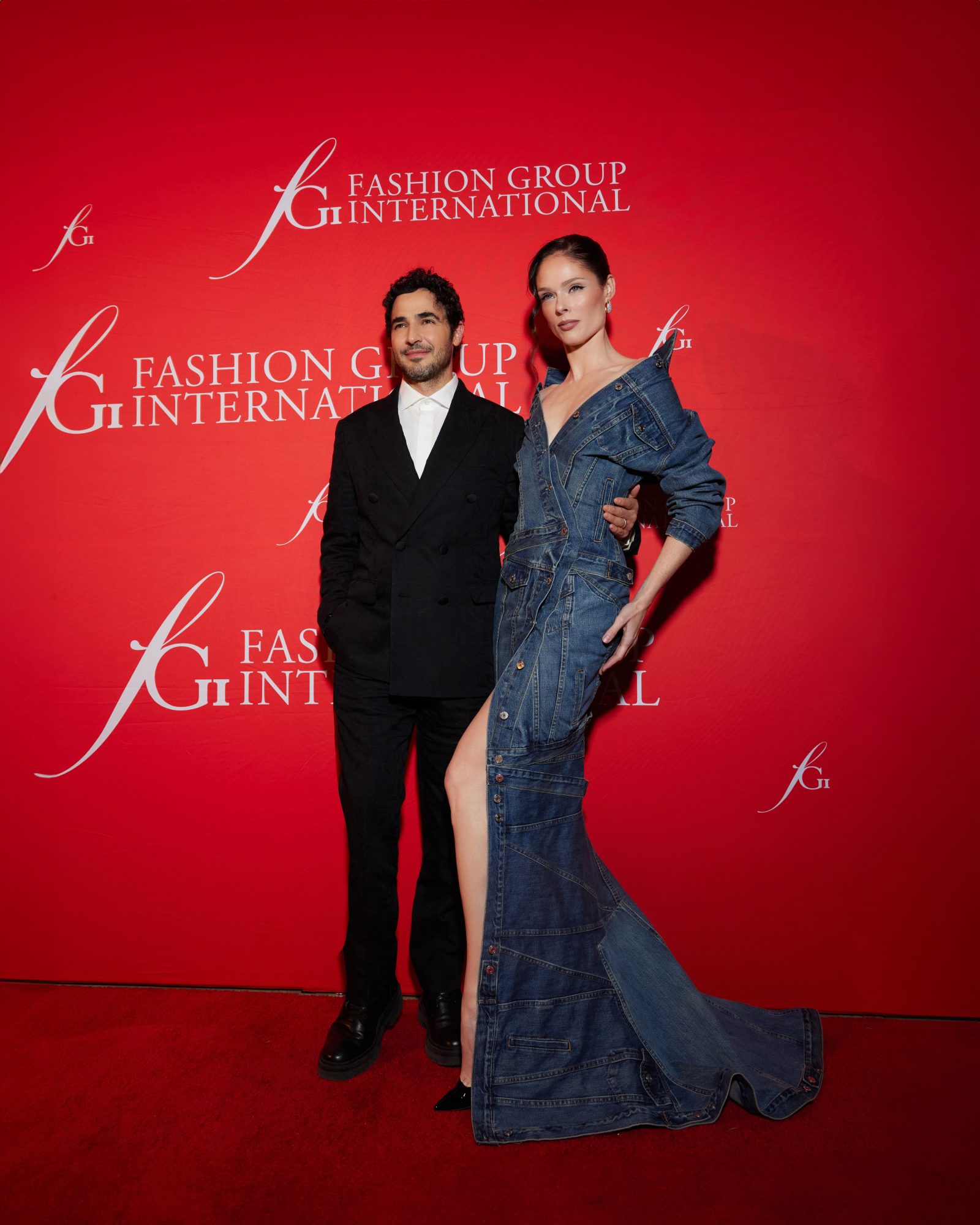 Coco Rocha is seen in a custom Gap Upcycled Denim Icon Dress alongside Gap Inc.’s Creative Director Zac Posen while attending the Fashion Group International 40th Anniversary Event (Photo Credit: Jeanie Stehr)