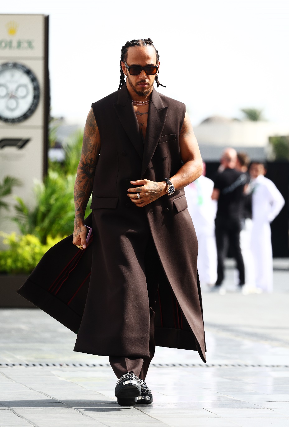Lewis Hamilton exudes sophistication in Gucci as he sports a bold monochrome look, drawing attention in the paddock before the F1 Grand Prix of Saudi Arabia. (Photo Credit: Gucci/Getty)