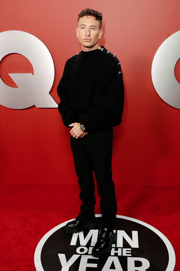 Barry Keoghan exhibits understated elegance in a jeweled Ferragamo sweater and tailored trousers at the GQ Men of the Year event in Los Angeles. (Photo Credit: Frazer Harrison for Getty courtesy of Ferragamo)