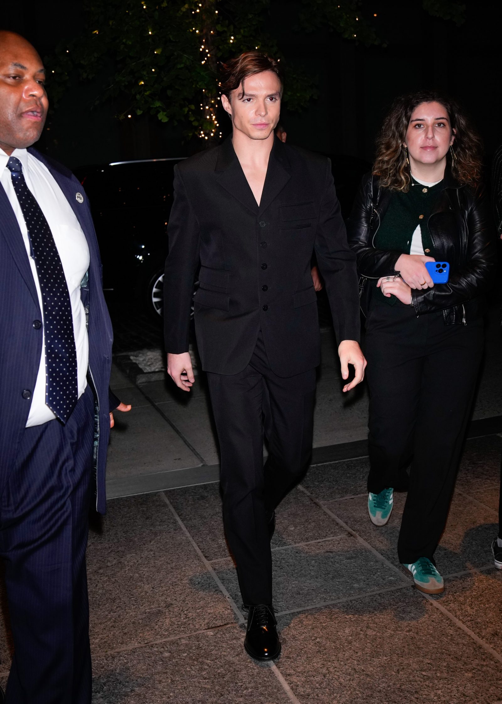 Actor Nicholas Alexander Chavez showcases Versace's refined tailoring in a sharp black wool grain de poudre suit from the Fall-Winter 2024 collection at the NYC screening of Monsters: The Lyle and Erik Menendez Story.