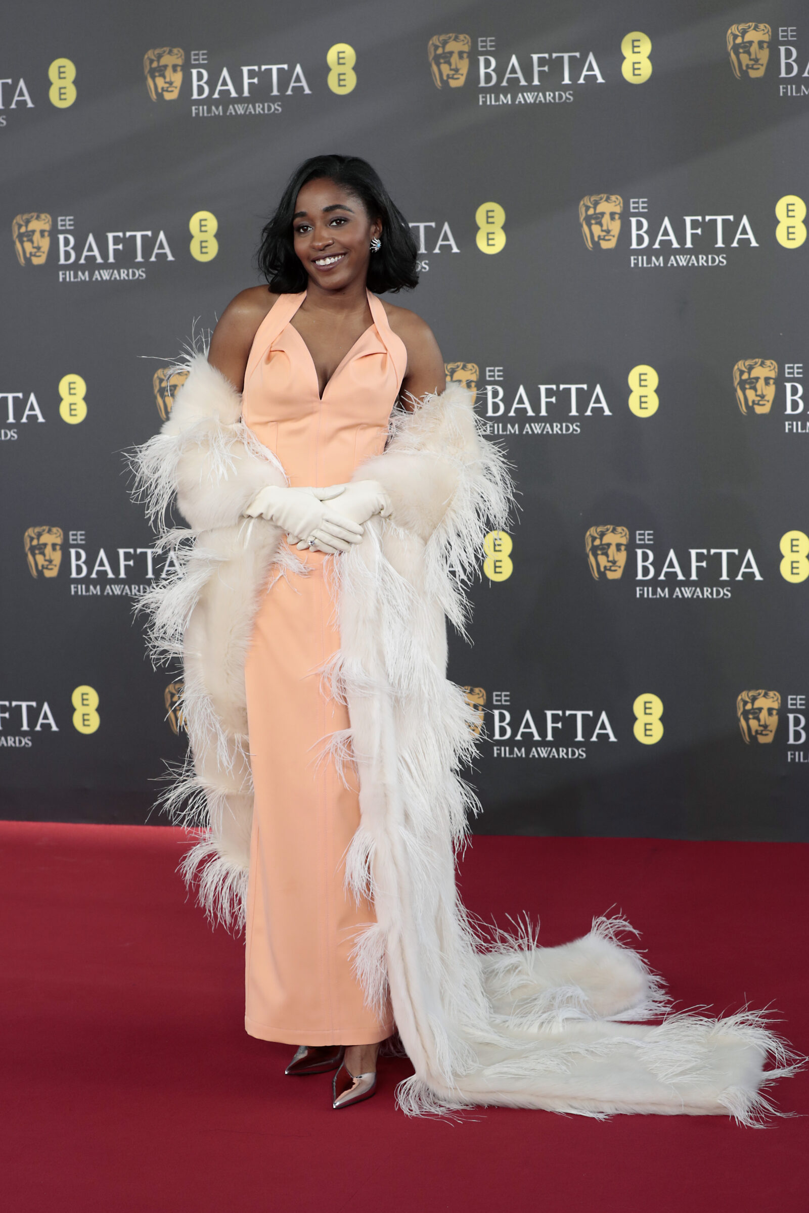 In a moment captured for eternity, Ayo Edebiri radiates confidence and grace at the 2024 EE BAFTA Film Awards at The Royal Festival Hall, a further reflection of her dazzling ascent. (Photo by John Phillips/Getty Images)