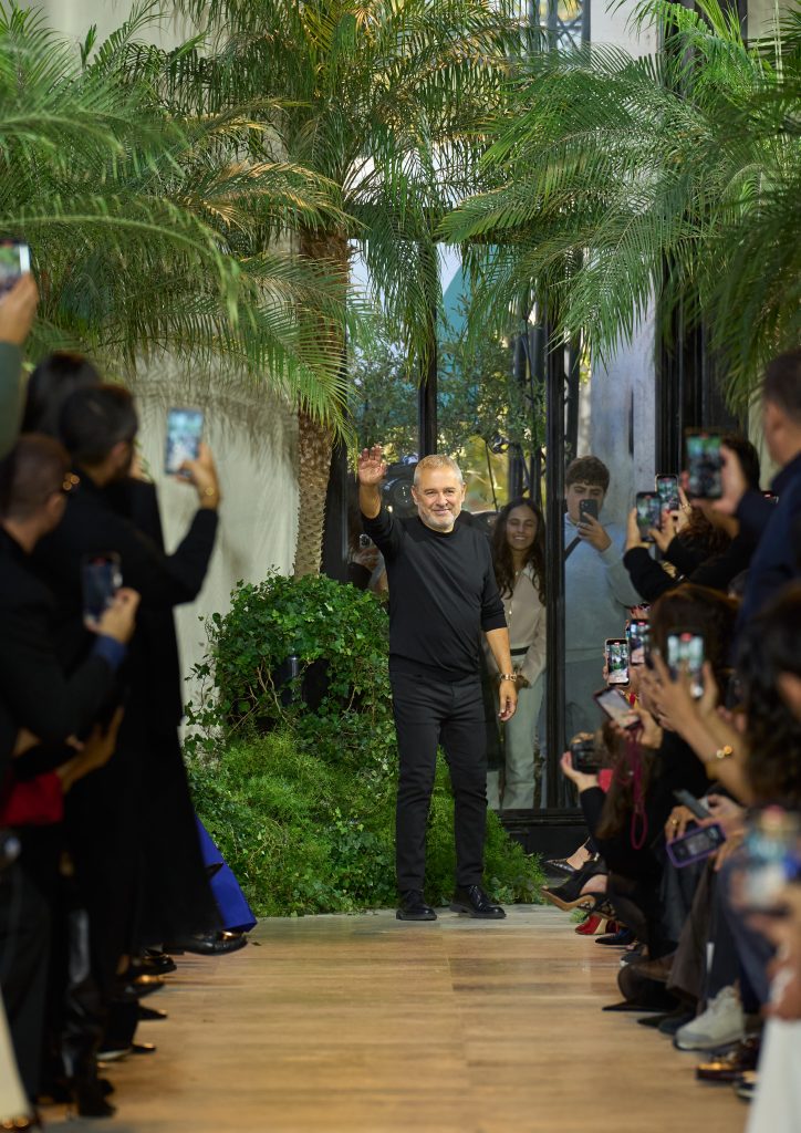 Elie Saab takes a bow at the close of the Elie Saab Spring-Summer 2025 ready-to-wear show in Paris.