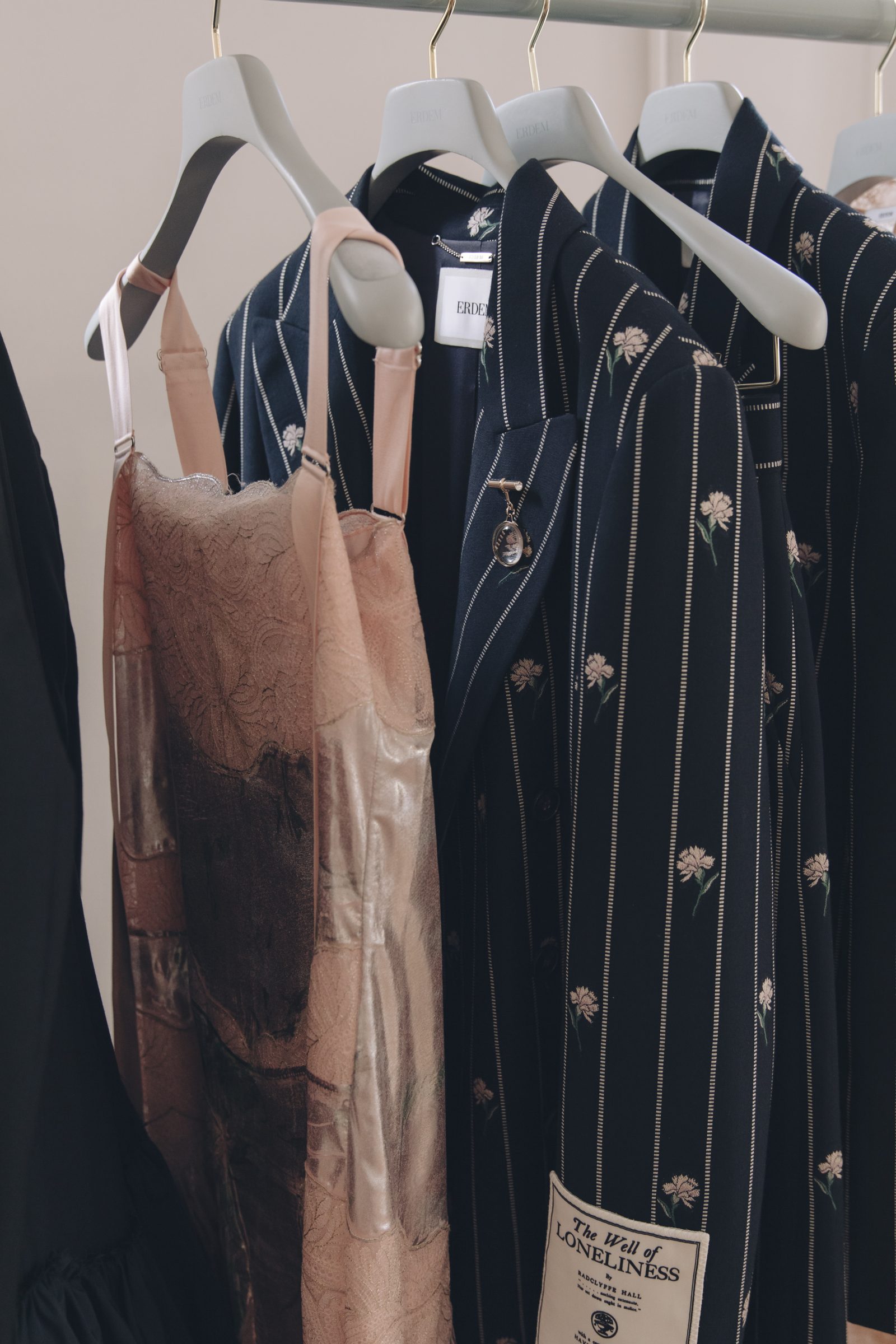 Floral detailing makes it way onto wide-striped blazers and adorned with the embroidered tale of its making on its sleeve (Image: Tonya Matyu).