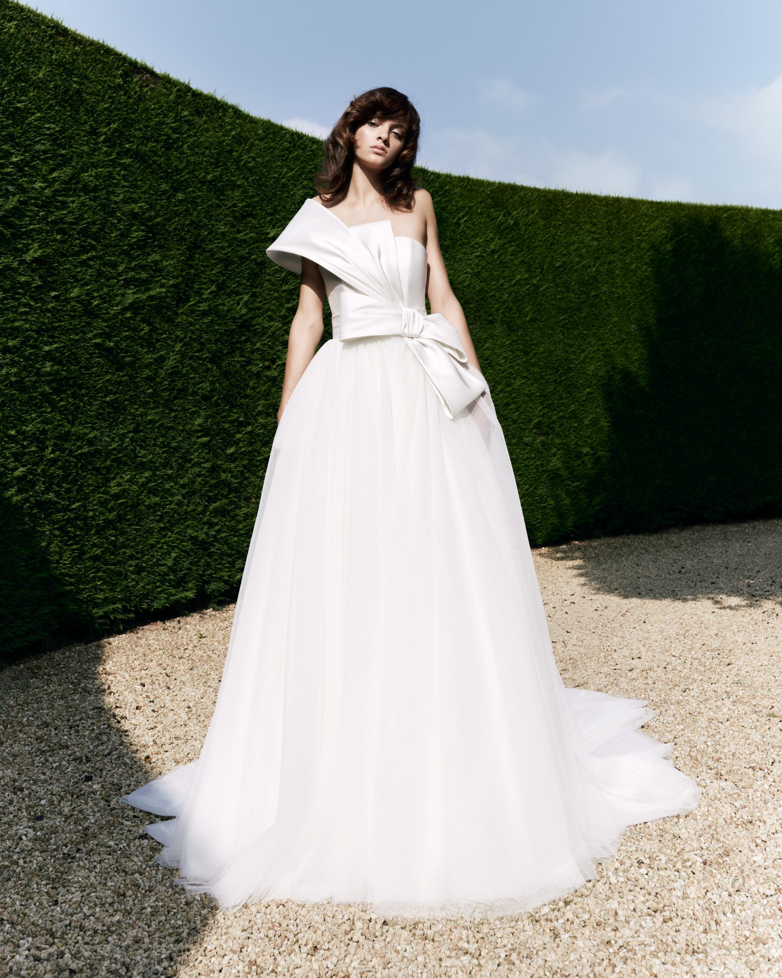 Flowerbomb Ribbon Ballgown: The epitome of drama, featuring a bold shoulder bow that flows into a voluminous tulle skirt.