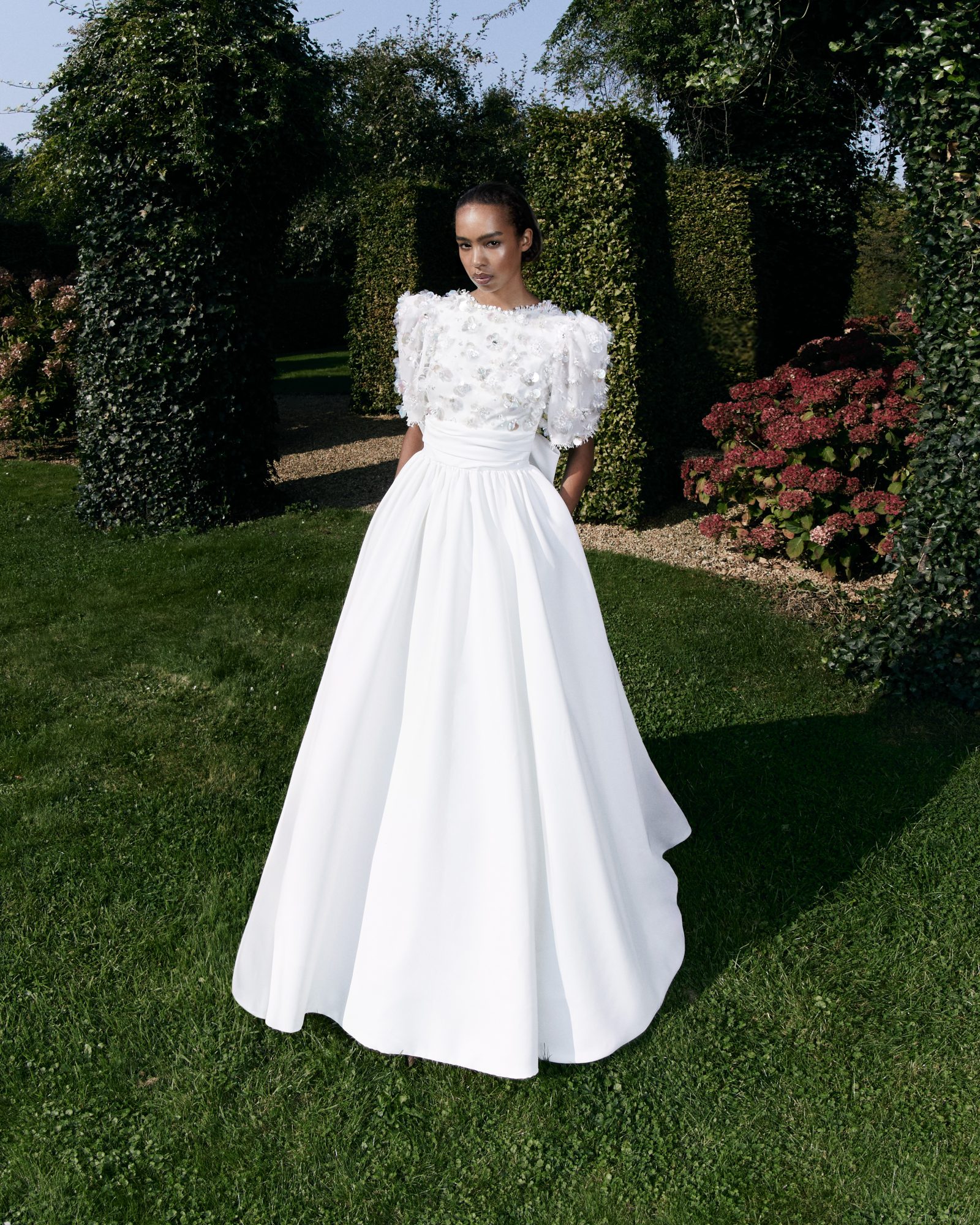 Pailette Floral Gardens Column A-line: A modern A-line silhouette blooms with intricate floral paillette embroidery.