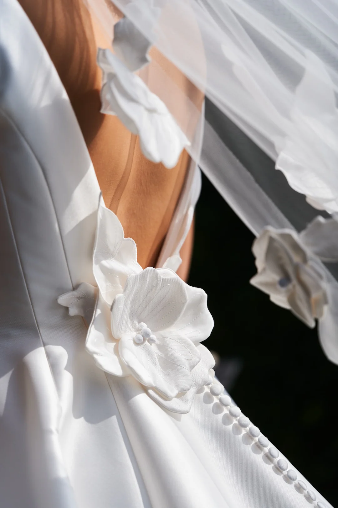 Intricate Florals Gown detail: A close-up revealing the exquisite craftsmanship of handcrafted floral embellishments.