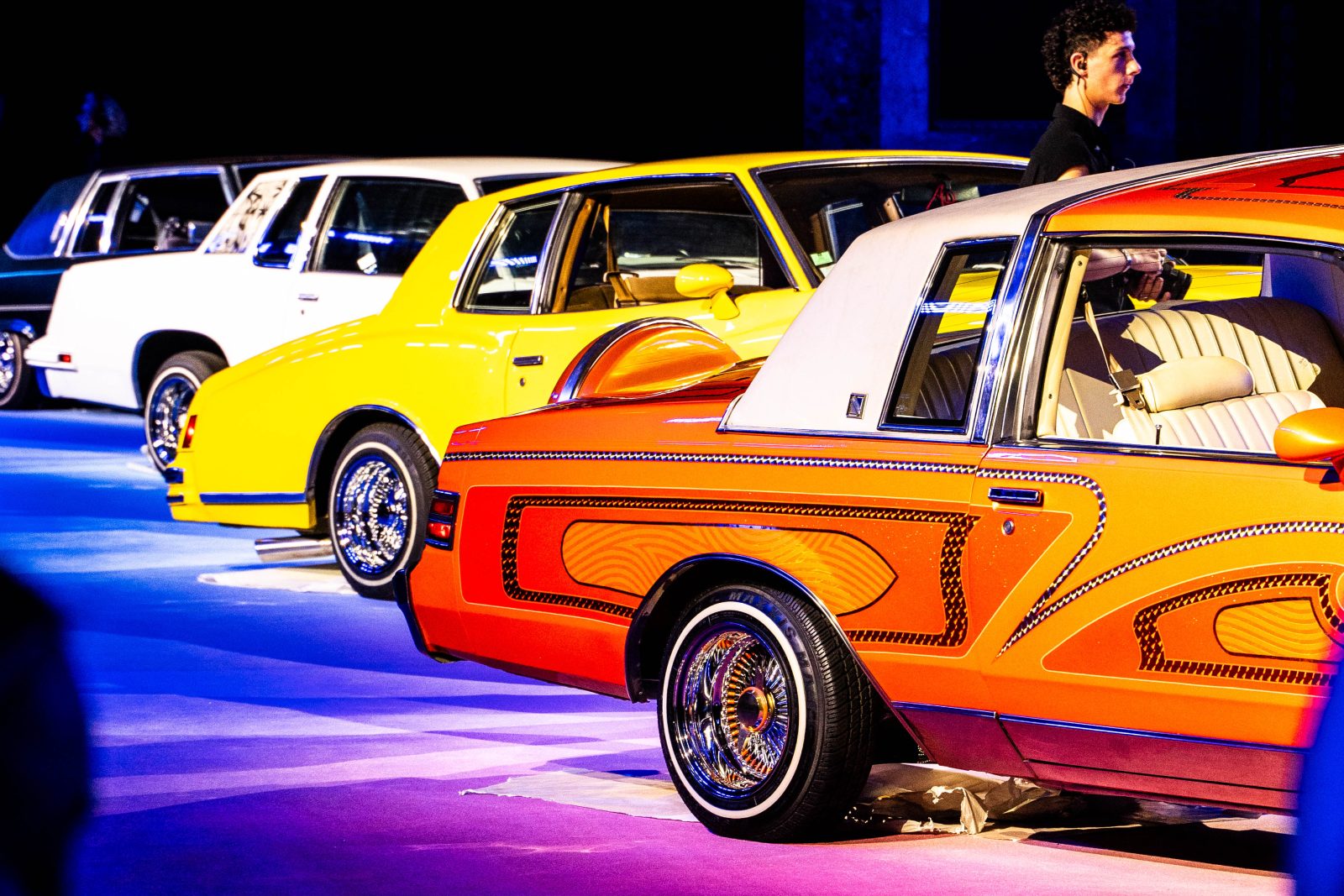 Immaculate lowrider vintage cars line the runway at Casablanca’s Spring-Summer 2025 show in Paris (Image: Edward Wendt)