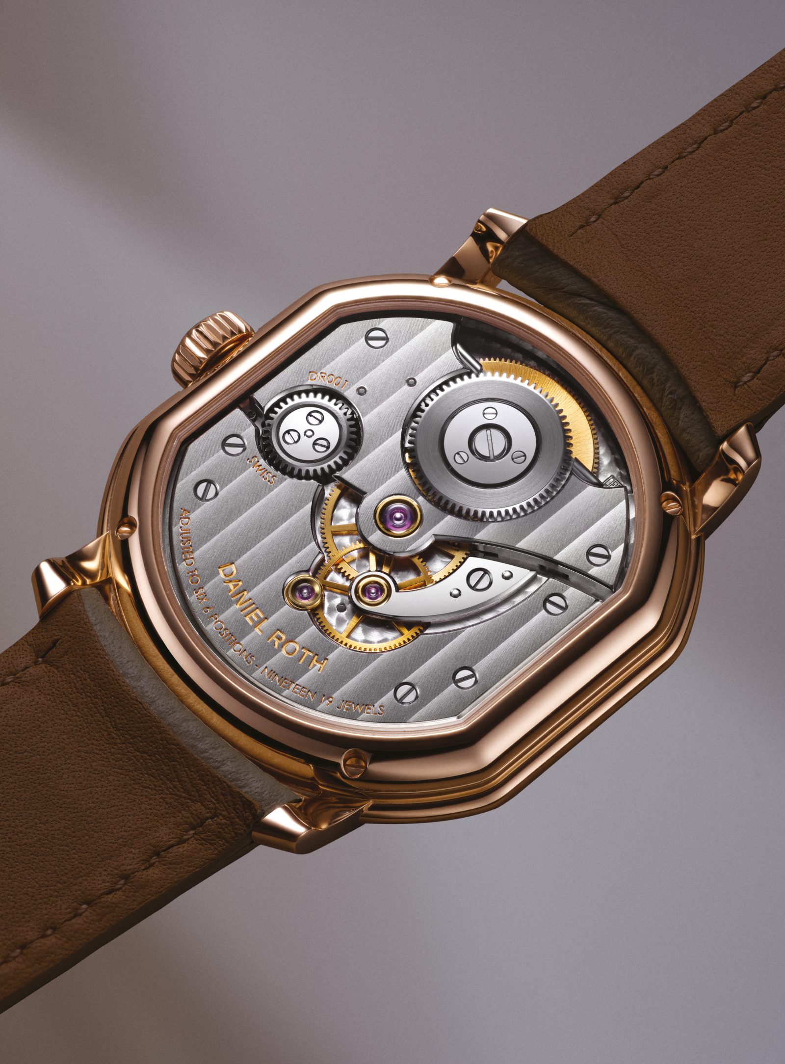 Daniel Roth’s latest horological innovation, the Tourbillon Rose Gold, features a view of the DR001 calibre movement through the 5N Rose Gold double-ellipse case’s sapphire back.