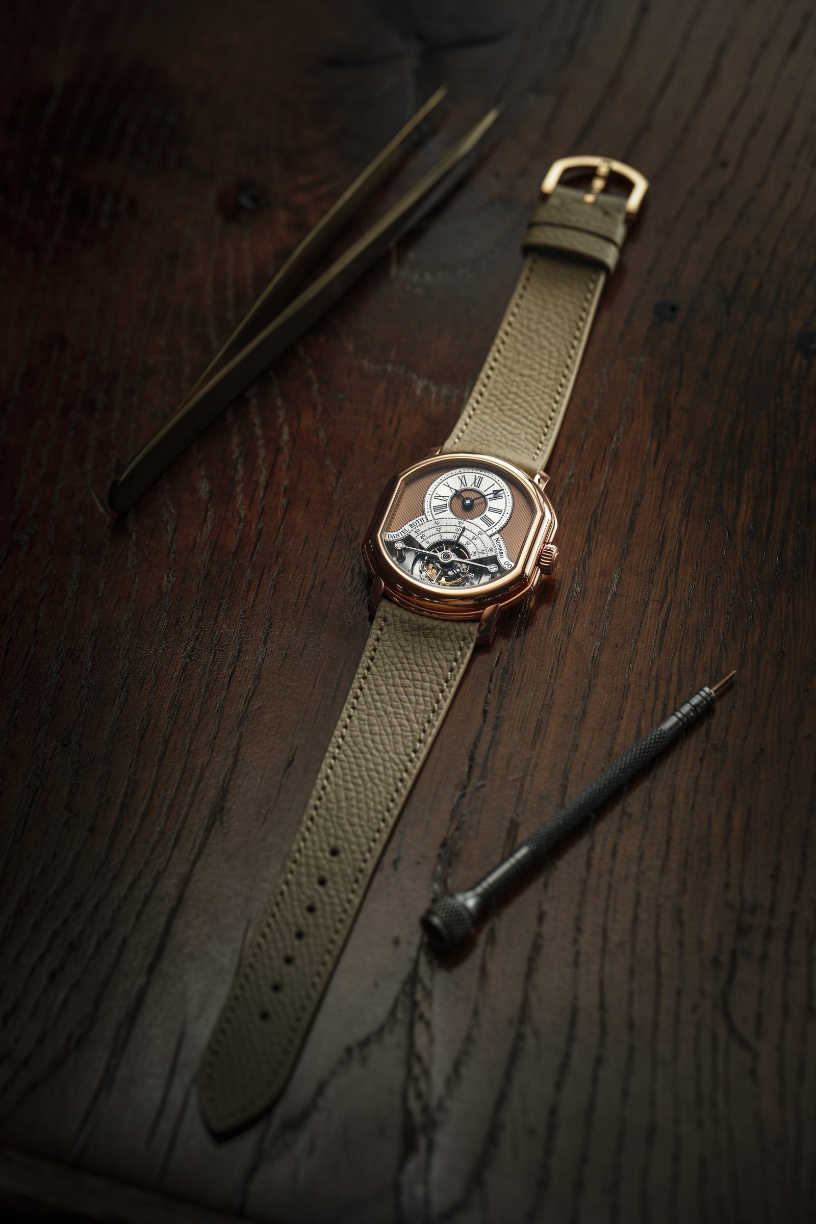 The DR001 calibre showcases exquisite horlogerie finishing, from vertical Côtes de Genève and mirror-polished anglage to the black-polished tourbillon bridge and carriage, exemplifying Daniel Roth's meticulous attention to detail.