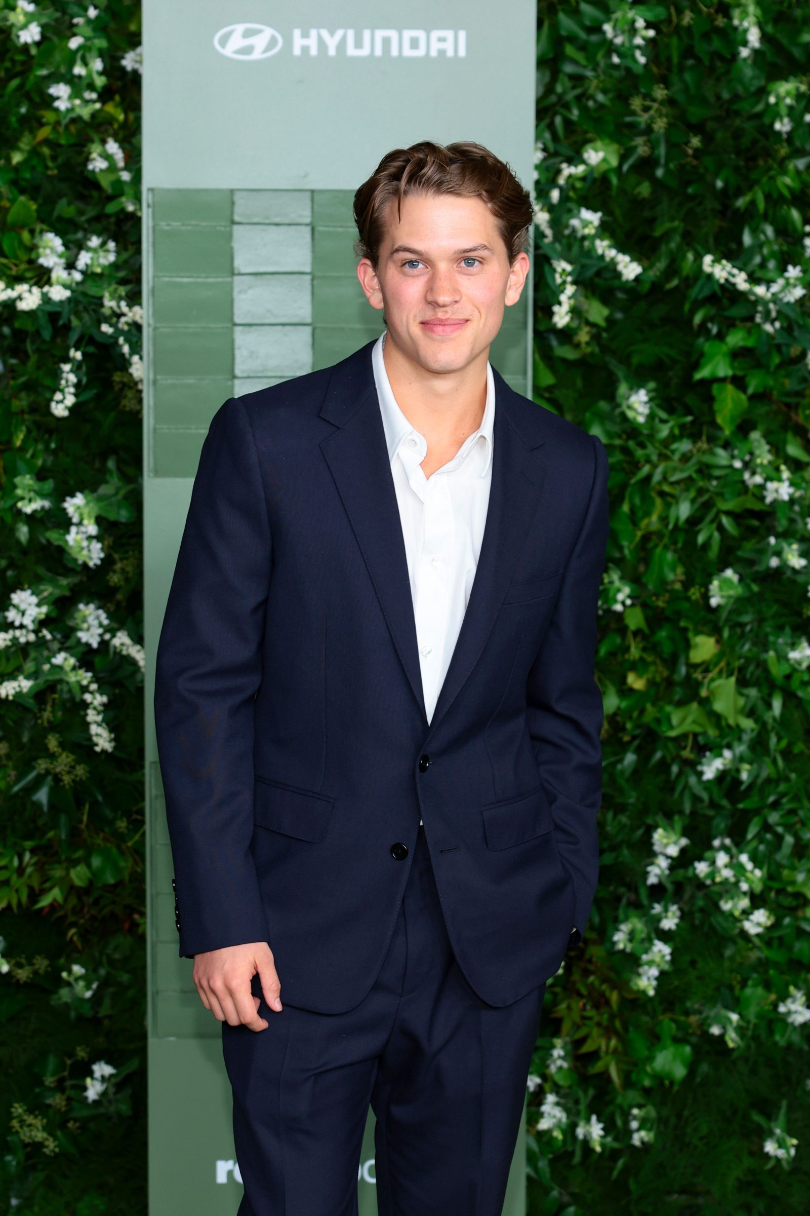 Deacon Phillippe in CELINE HOMME navy wool gabardine suit, white poplin shirt and polished black Luco loafers at the WSJ. Magazine Innovator Awards, New York (Getty Images)