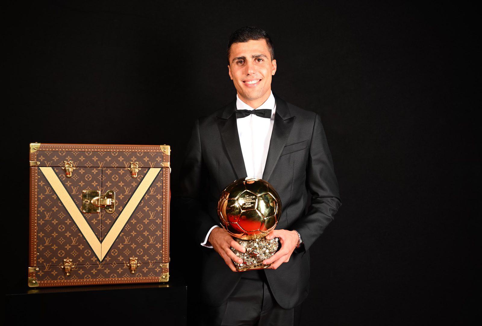 Manchester City's Rodri celebrates with his Ballon d'Or trophy, marking his achievement as best male footballer of the year at the Paris ceremony. (Photo: Courtesy of Louis Vuitton)