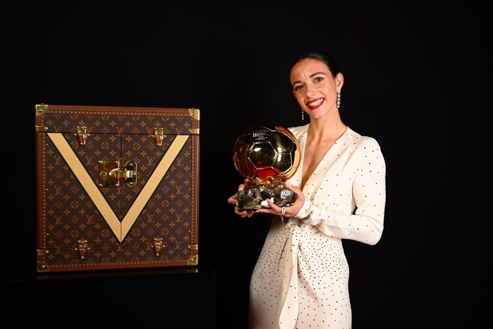 Aitana Bonmatí poses with her Ballon d'Or trophy alongside the Louis Vuitton Trophy Trunk at the 2024 ceremony in Paris. (Photo: Courtesy of Louis Vuitton)
