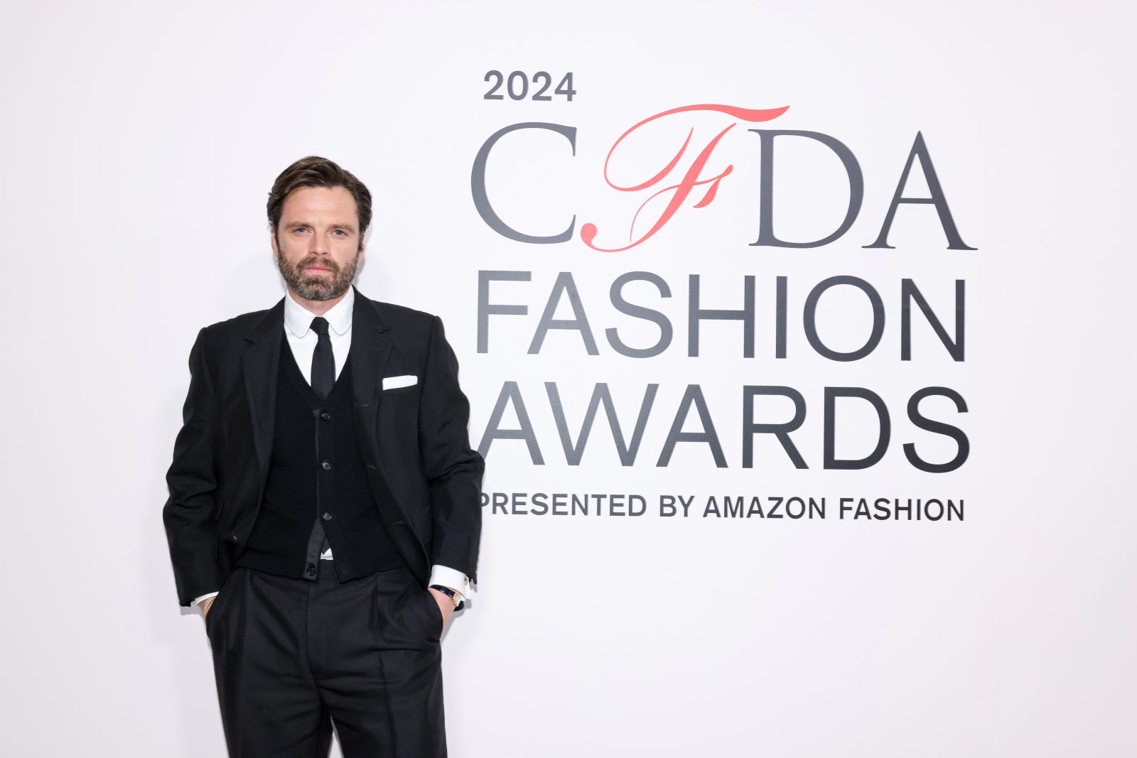 Actor Sebastian Stan champions Thom Browne's revolutionary approach to menswear, sporting a precisely calibrated look that challenges traditional masculine dress codes. (Image: BFA)
