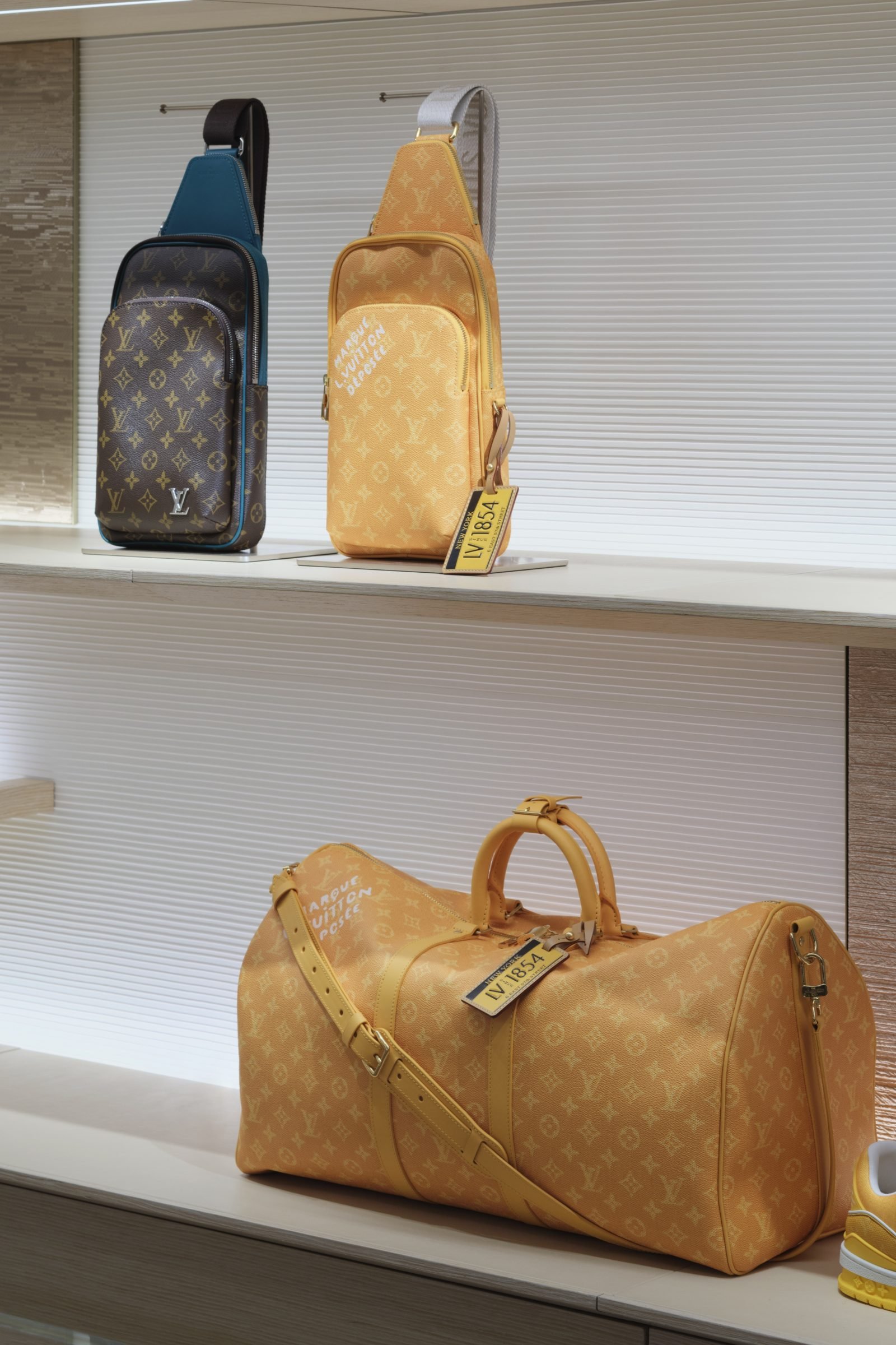The New York City capsule collection reinterprets iconic pieces in taxi-yellow hues, including the Avenue Slingbag and Keepall crafted from Monogram Héritage leather.