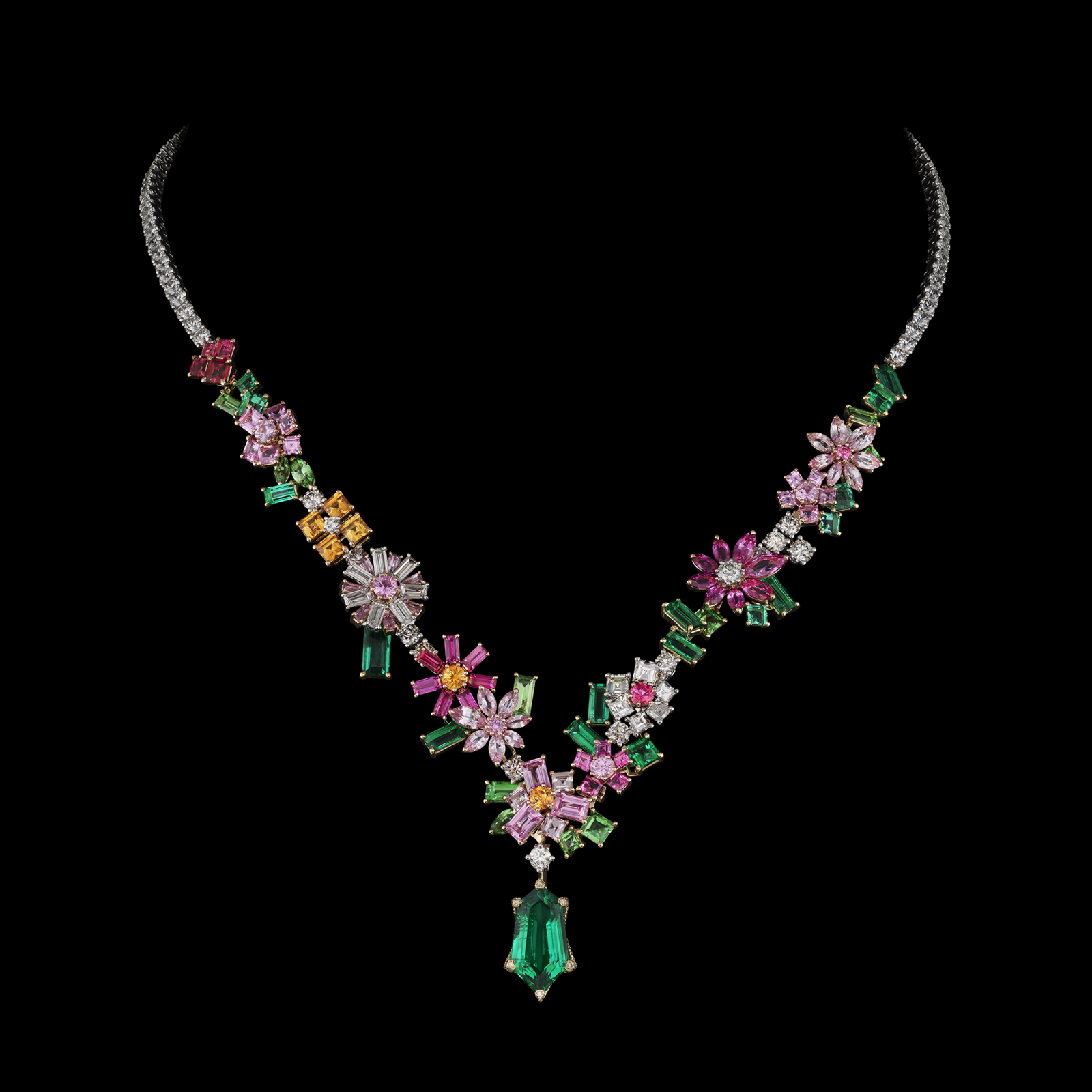 This masterpiece combines white, pink, and yellow gold with diamonds, rubies, emeralds, and vibrant pink sapphires, creating a harmonious display of bold color and refined elegance.
