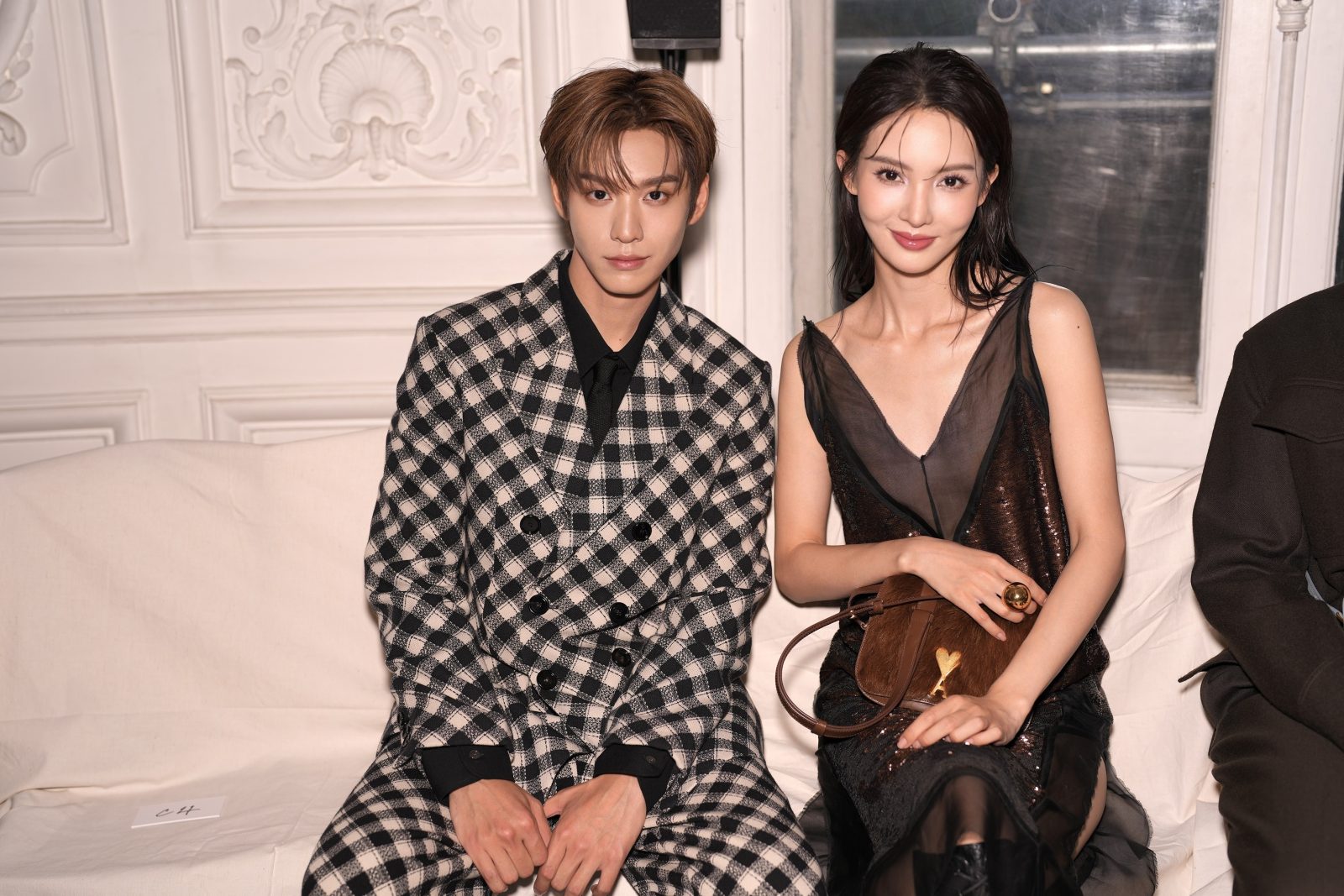 Tony Yu and Chen Jin attend the AMI Spring Summer 2025 fashion show in Paris.