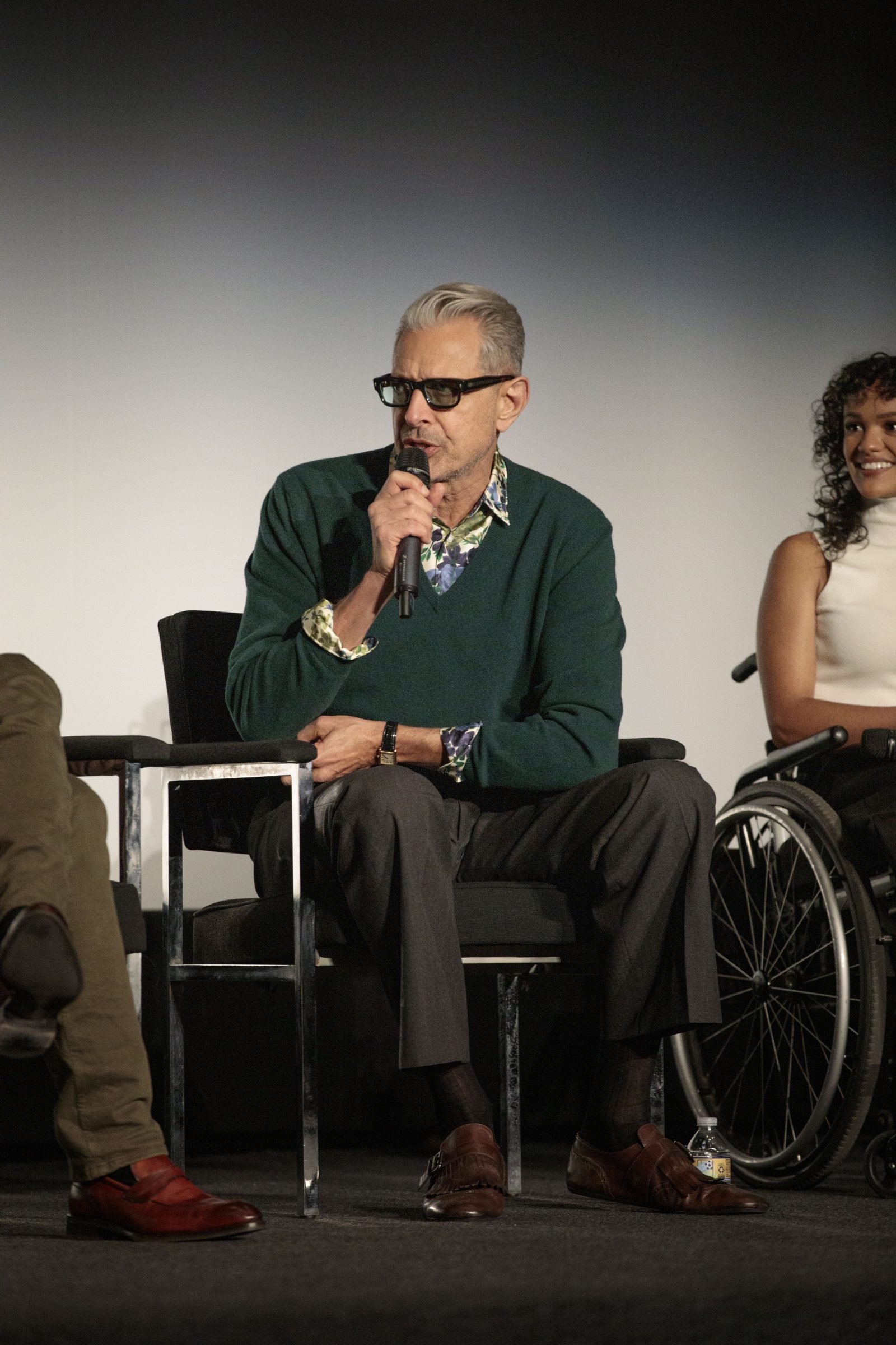 Goldblum demonstrates Prada's layering expertise in a forest green v-neck over a floral silk shirt at the "Wicked" screening. (Photo: Benjamin Shmikler/ABImages)
