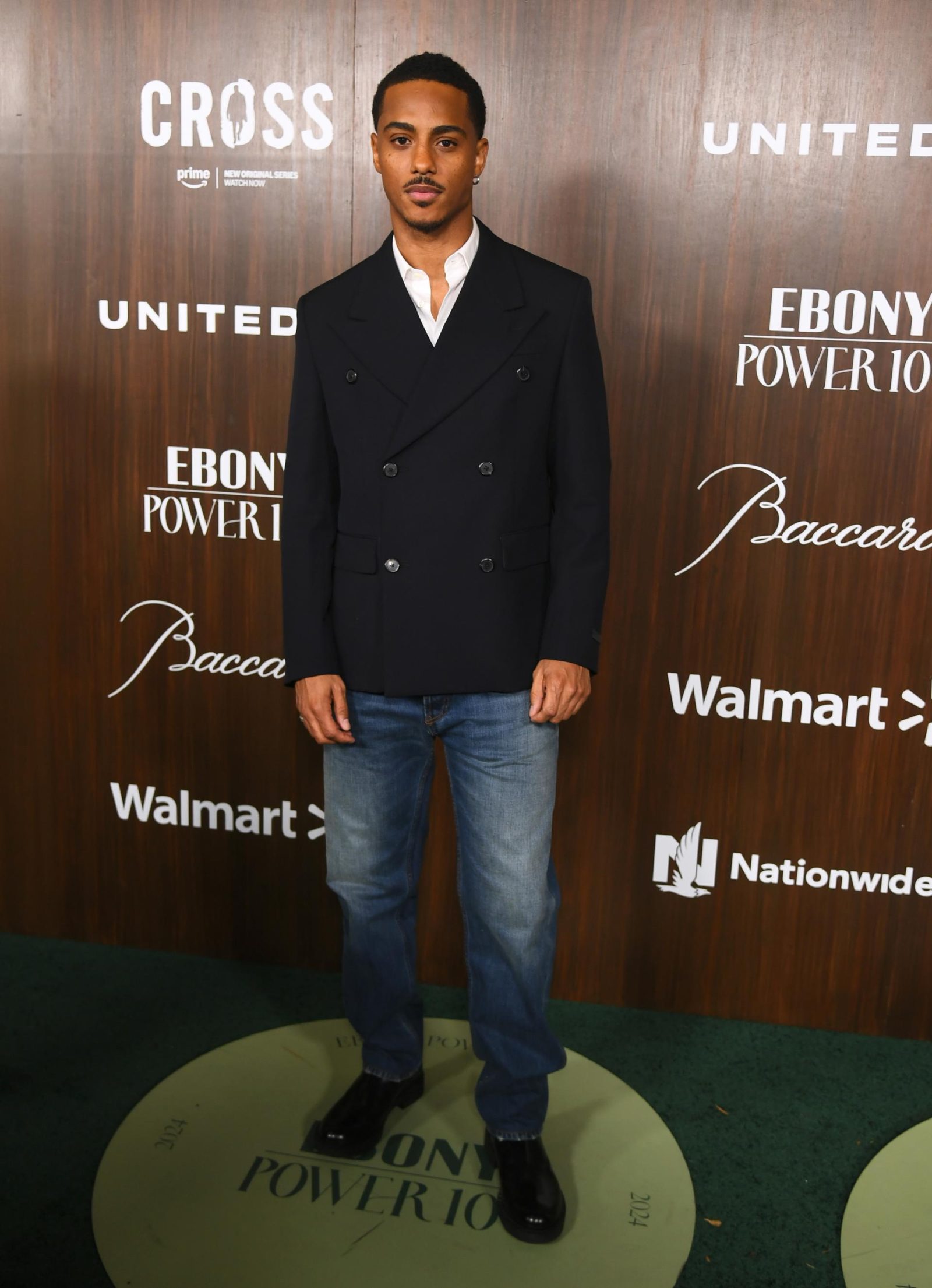 Keith Powers elevates casual wear in a sharp double-breasted jacket and denim at the EBONY Power 100 Gala. (Photo: Courtesy of Prada)