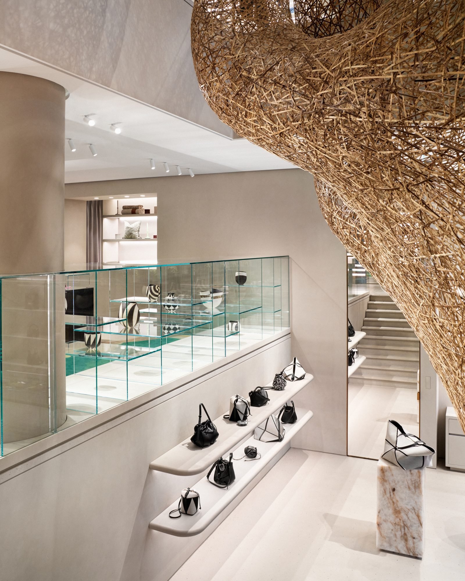 On right: Japanese artist Tanabe Chikuunsai IV's "Source of Creation" (2024) winds through the capacious space.