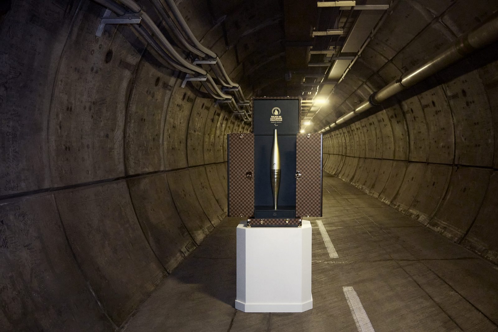 The Paris 2024 Paralympic Torch, housed in the Louis Vuitton Torch Trunk, photographed within the Channel Tunnel.