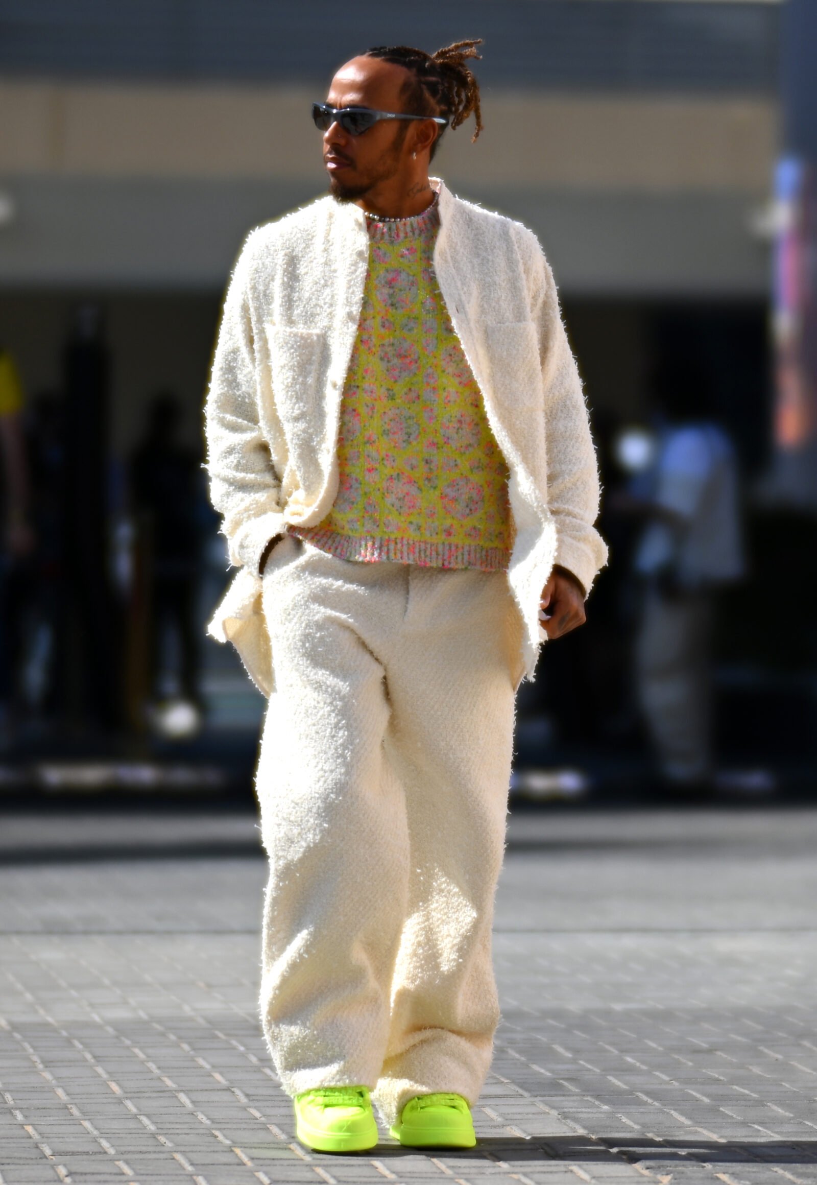 Speed and Elegance: Lewis Hamilton channels the essence of Dior at the Abu Dhabi Grand Prix. (Photo by Clive Mason - Formula 1/Formula 1 via Getty Images, courtesy of Dior)