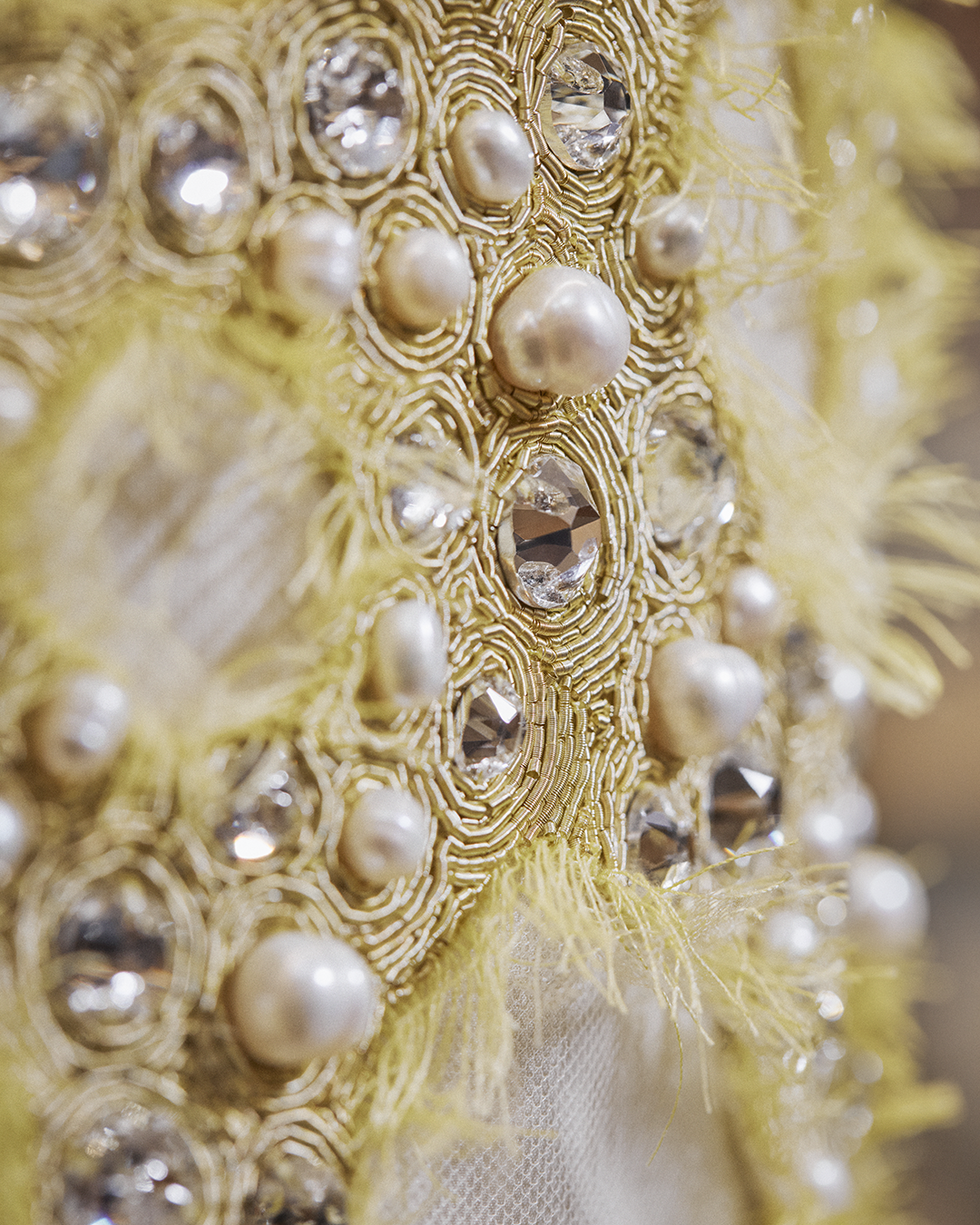 The ornate pearl and hand embroidered details that created Emma Stone’s ensemble with elegance.