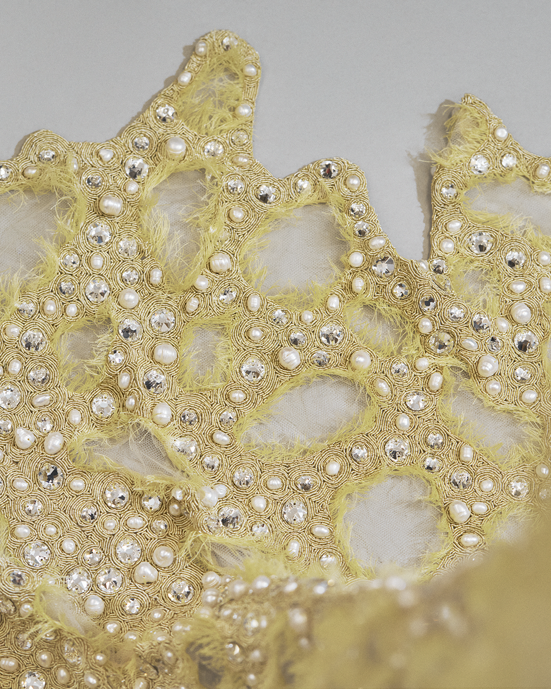 A symphony of tulle and light: the layered finesse of the gown.