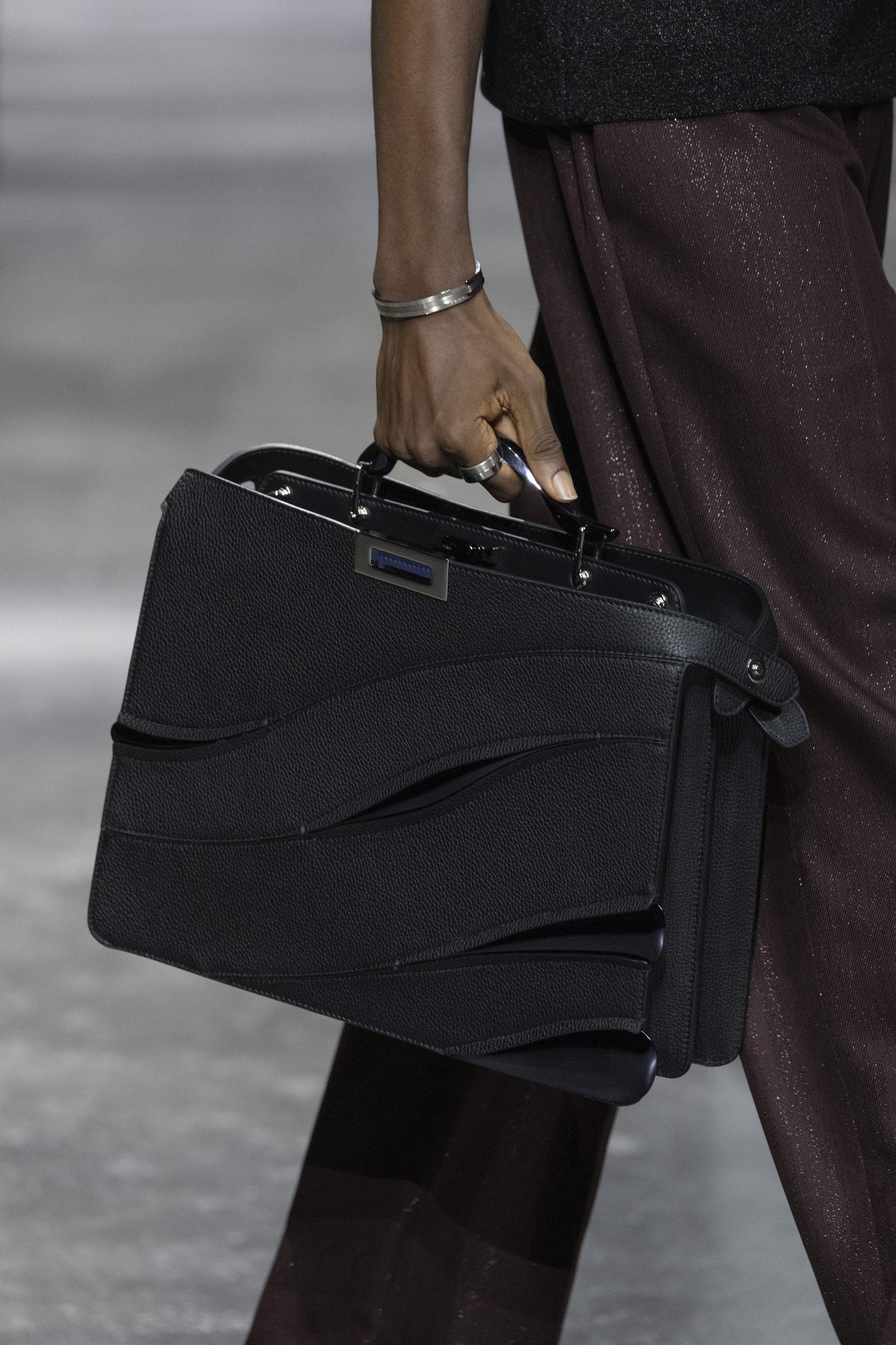 The MAD x FENDI Peekaboo ISeeU medium, offered in black, is seen on the runway.