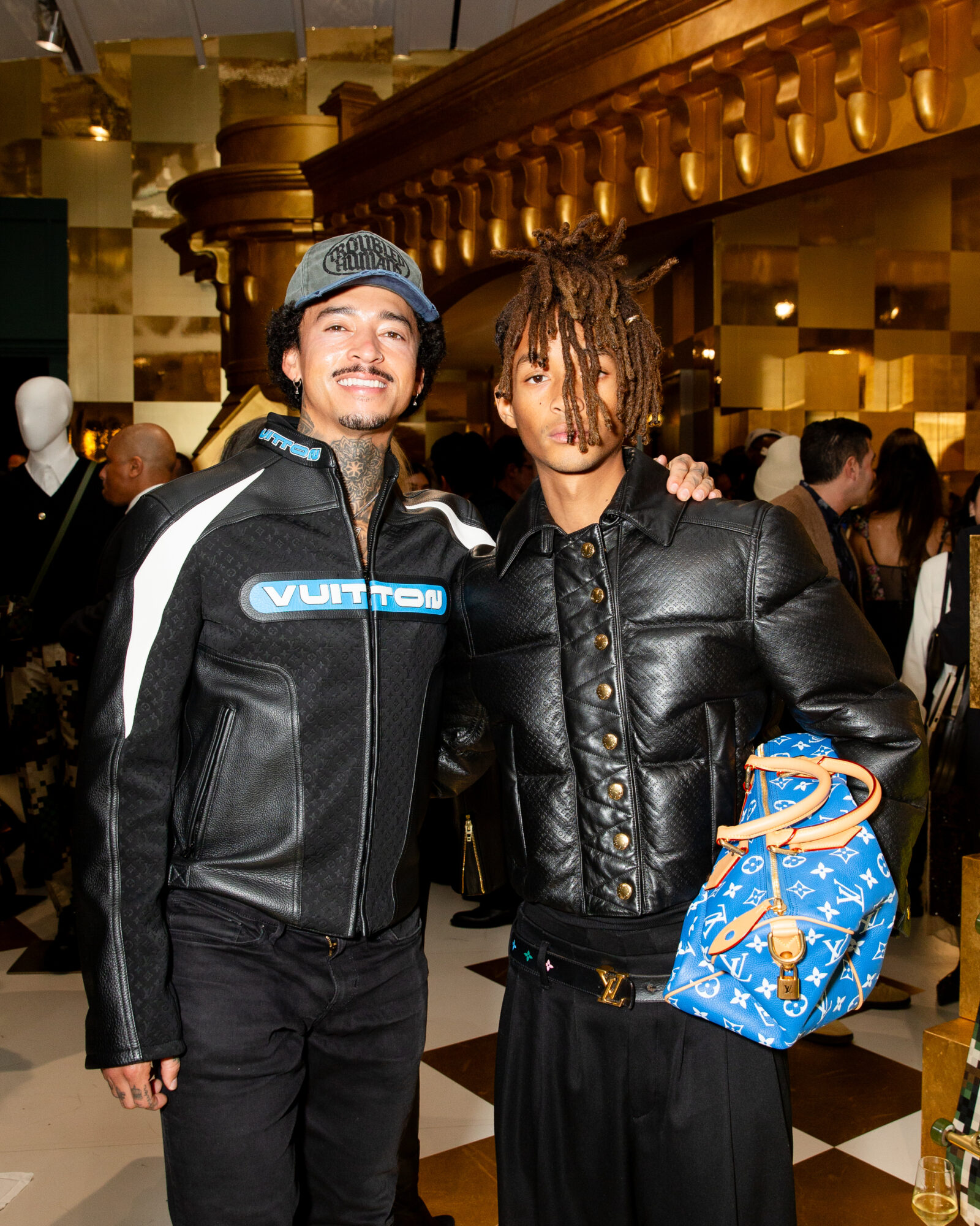 Nyjah Huston and Jaden Smith, both icons of youth and style, exchange smiles, each donning pieces that resonate with the collection’s energetic essence.