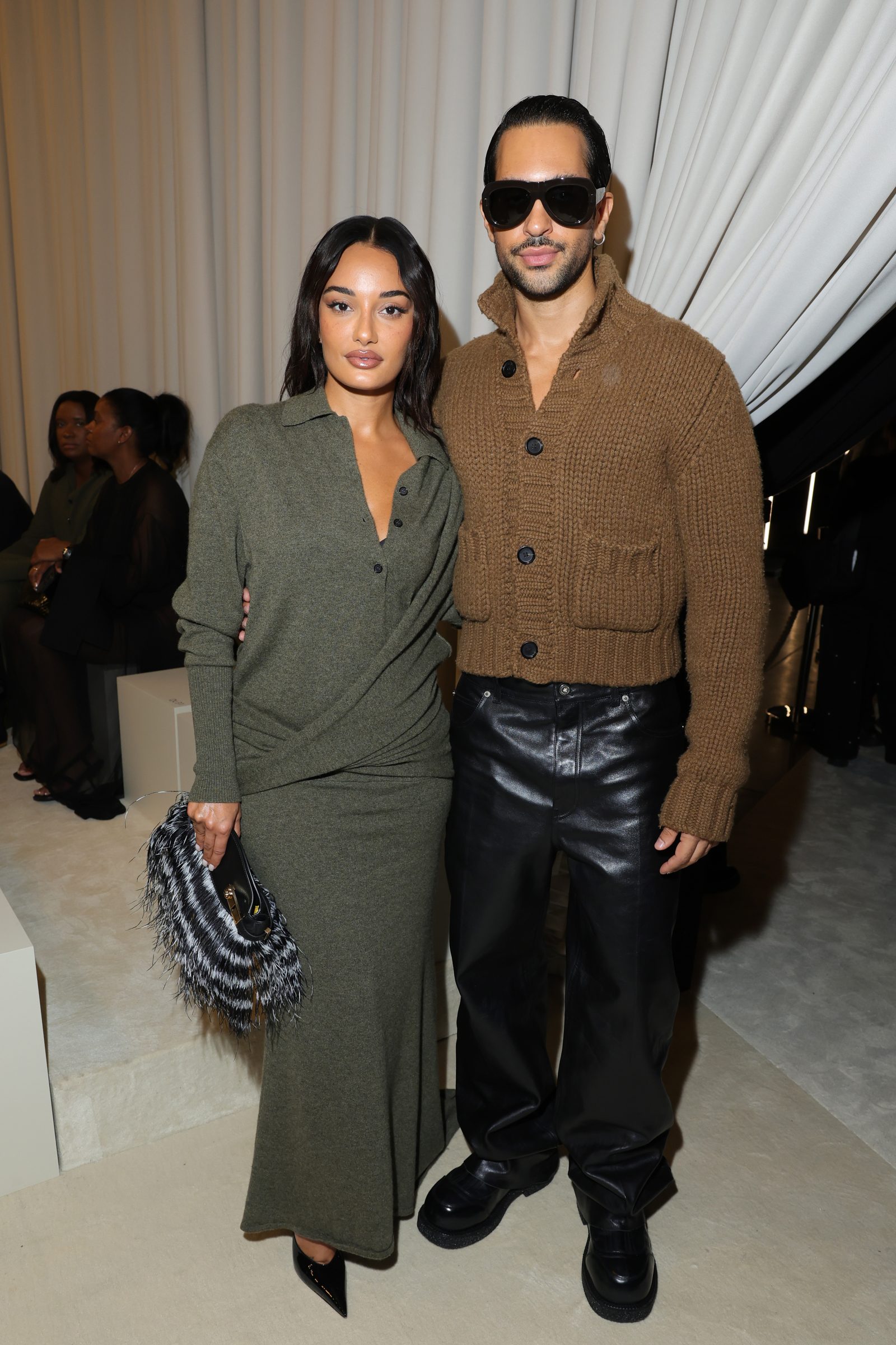 Amina Muaddi and Mahmood are seen front row at the Ferragamo Spring Summer 2025 Fashion Show during the Milan Fashion Week Spring/Summer 2025 on September 21, 2024 in Milan, Italy. (Photo by Jacopo M. Raule/Getty Images for Ferragamo)