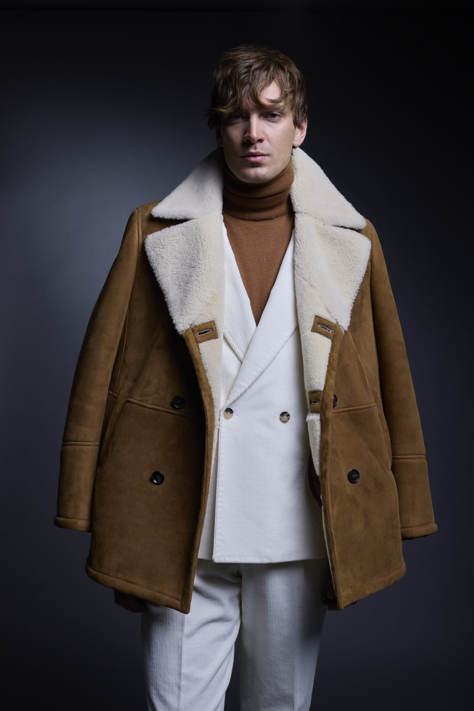 A corduroy suit and shearling-lined camel coat with turtleneck exemplifies ISAIA's mastery of luxurious winter layers. (Image: Courtesy of ISAIA)