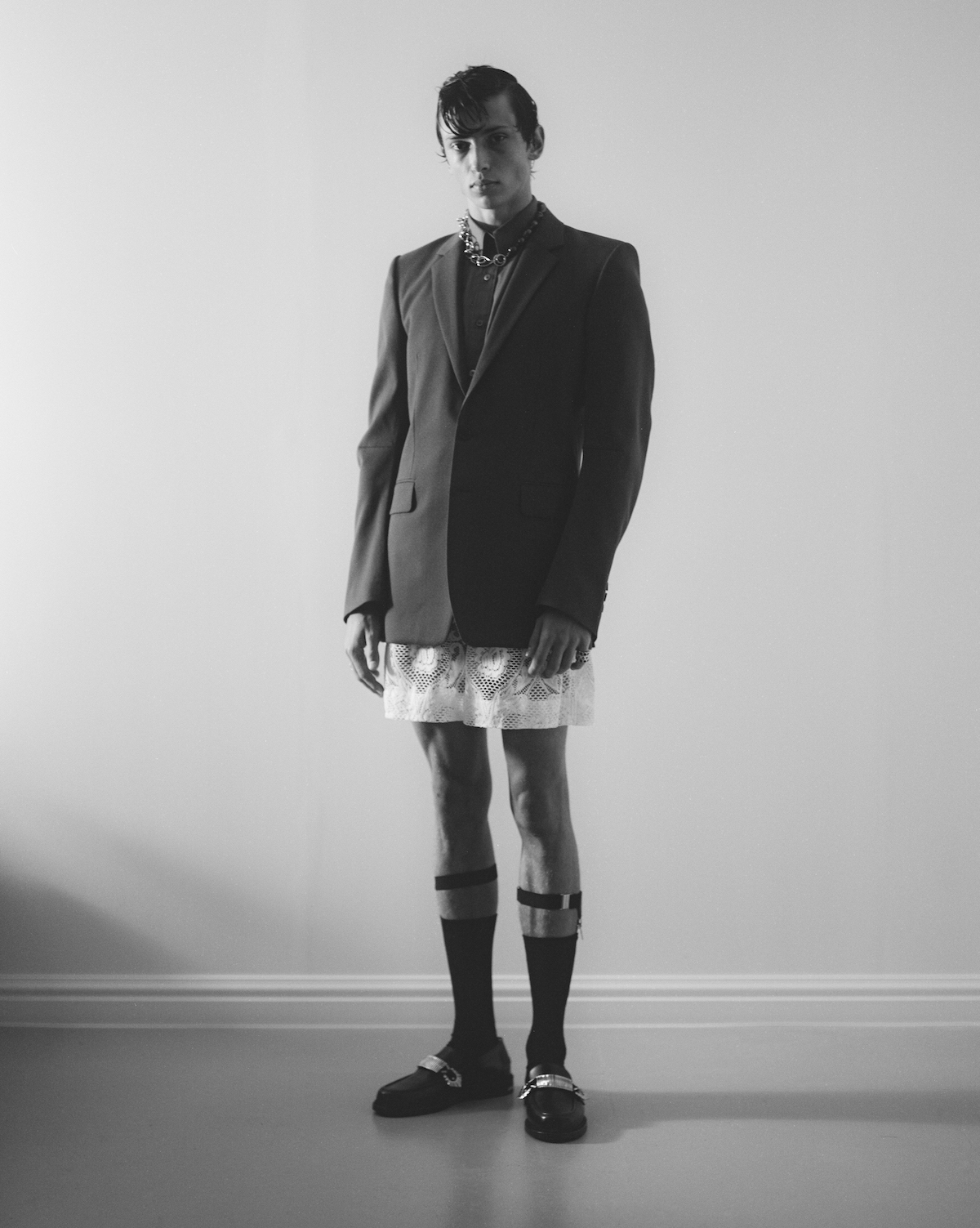 Blazer by JOHN LAWRENCE SULLIVAN, shirt by XANDER ZHOU, shorts by ADAM JONES, socks by FALKE, shoes by TOGA VIRILIS