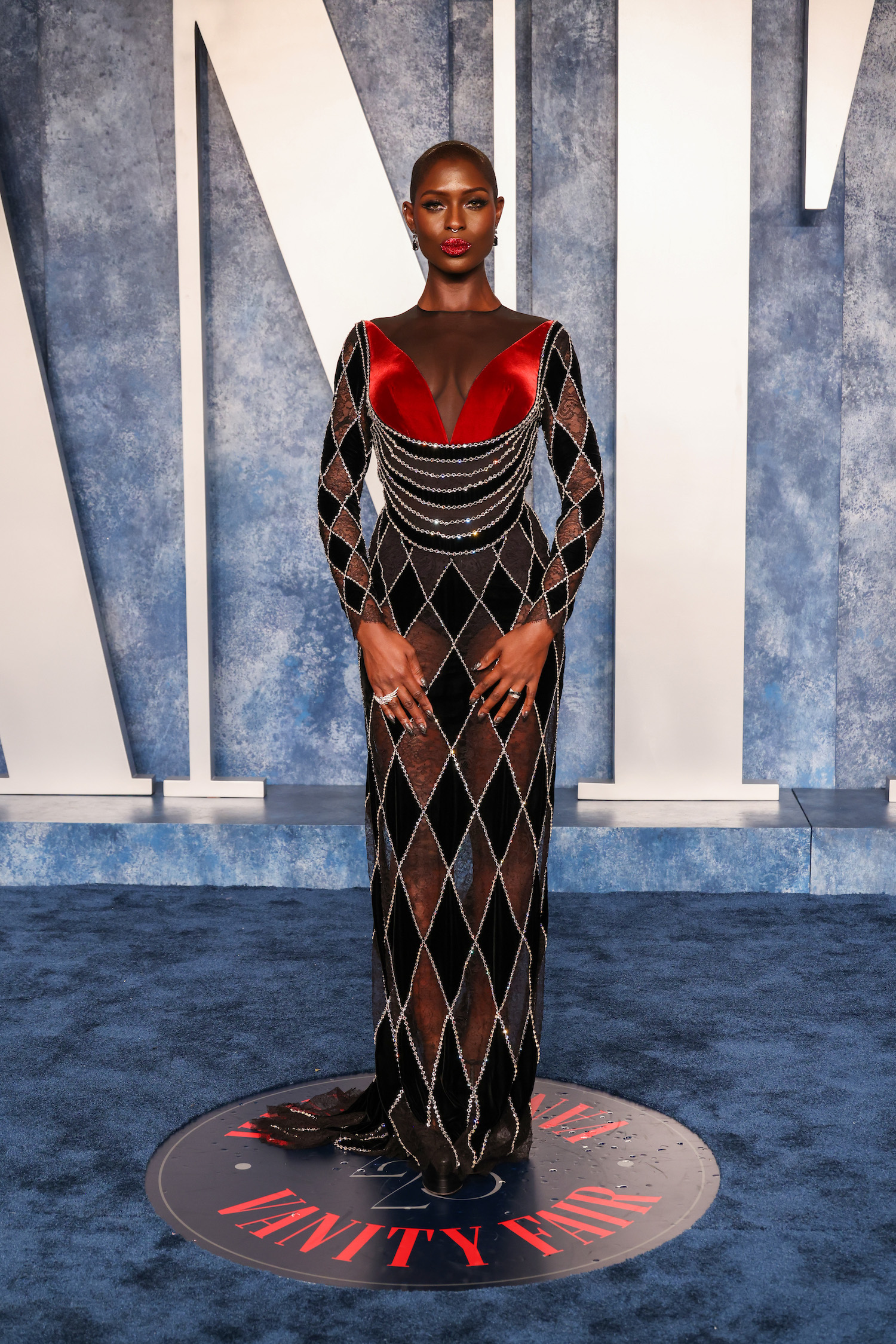 Jodie Turner-Smith wore a custom Gucci crystal-embroidered black and red velvet gown.