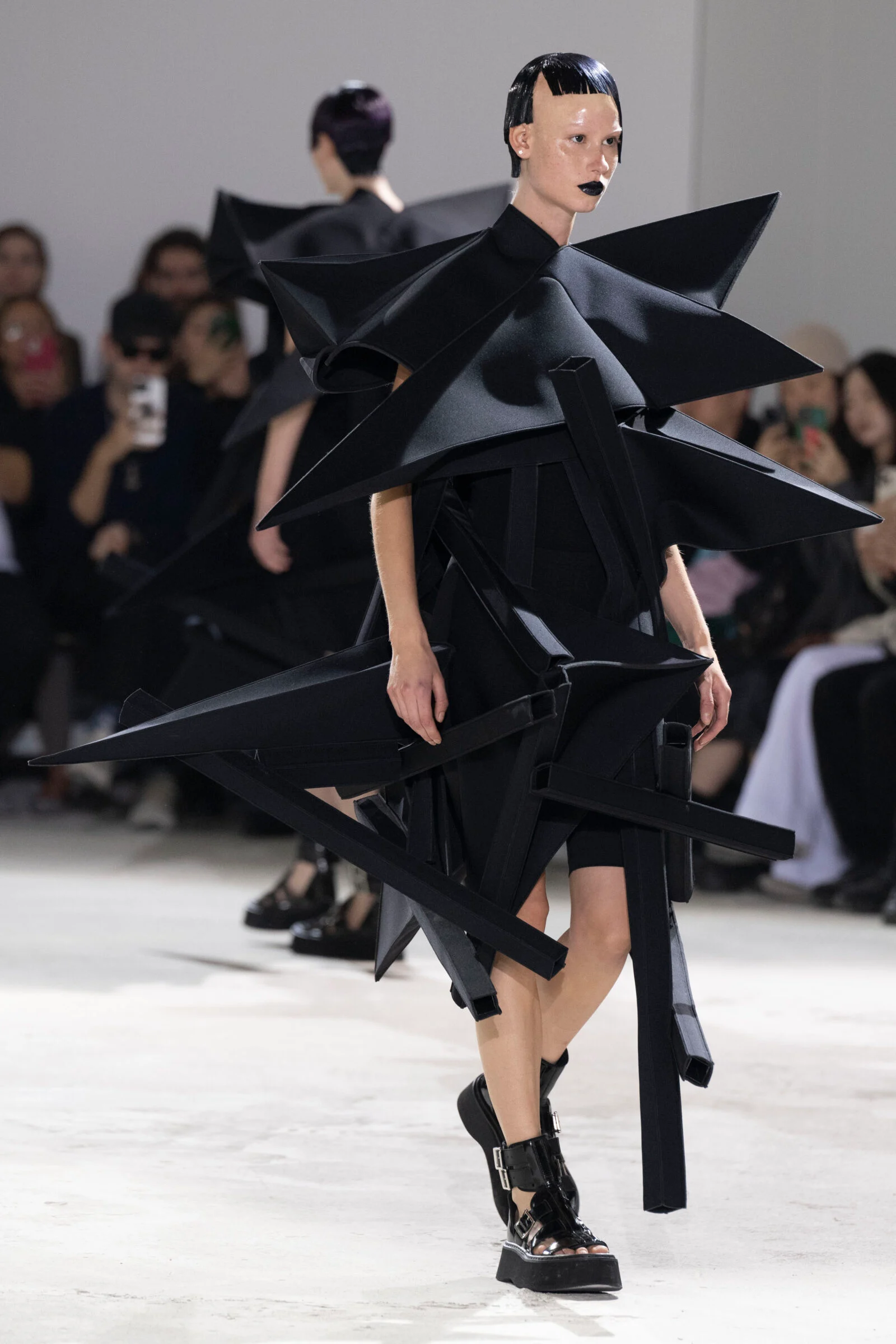 A Junya Watanabe creation breaks the mold, setting a new standard for avant-garde aesthetics in the industry. A Junya Watanabe creation breaks the mold, setting a new standard for avant-garde aesthetics in the industry.