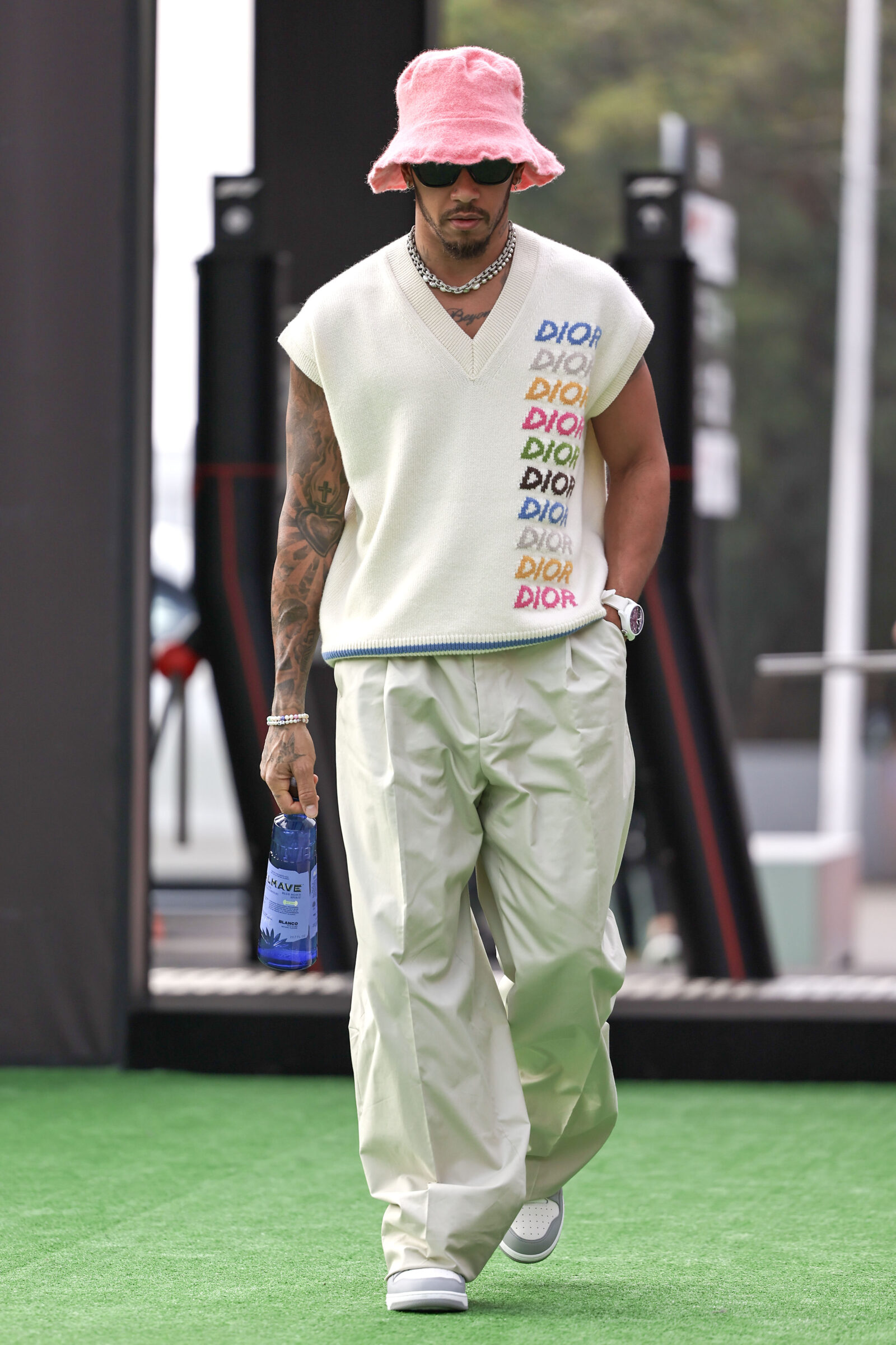 Lewis Hamilton exemplifies effortless cool at the Mexico Grand Prix, combining high fashion with racing passion. (Photo credit: Song Haiyuan/MB Media/Getty Images) Lewis Hamilton in Dior