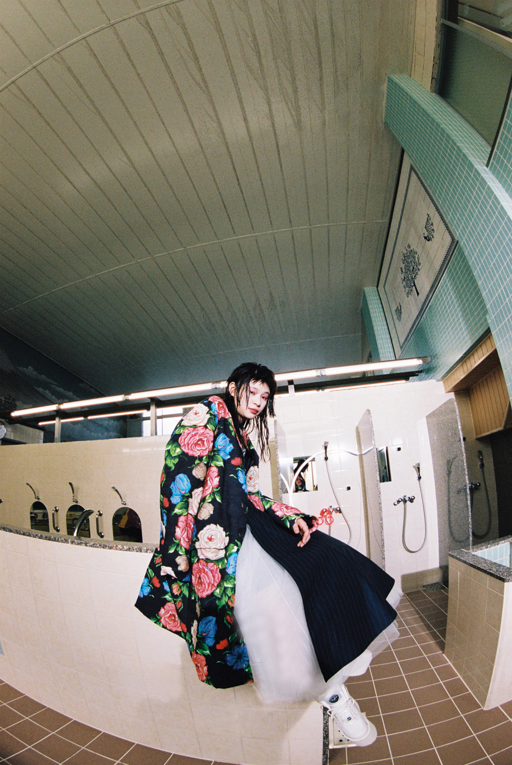 Coat by NINA RICCI, top, skirt, and sneakers by JUNYA WATANABE COMME DES GARÇONS