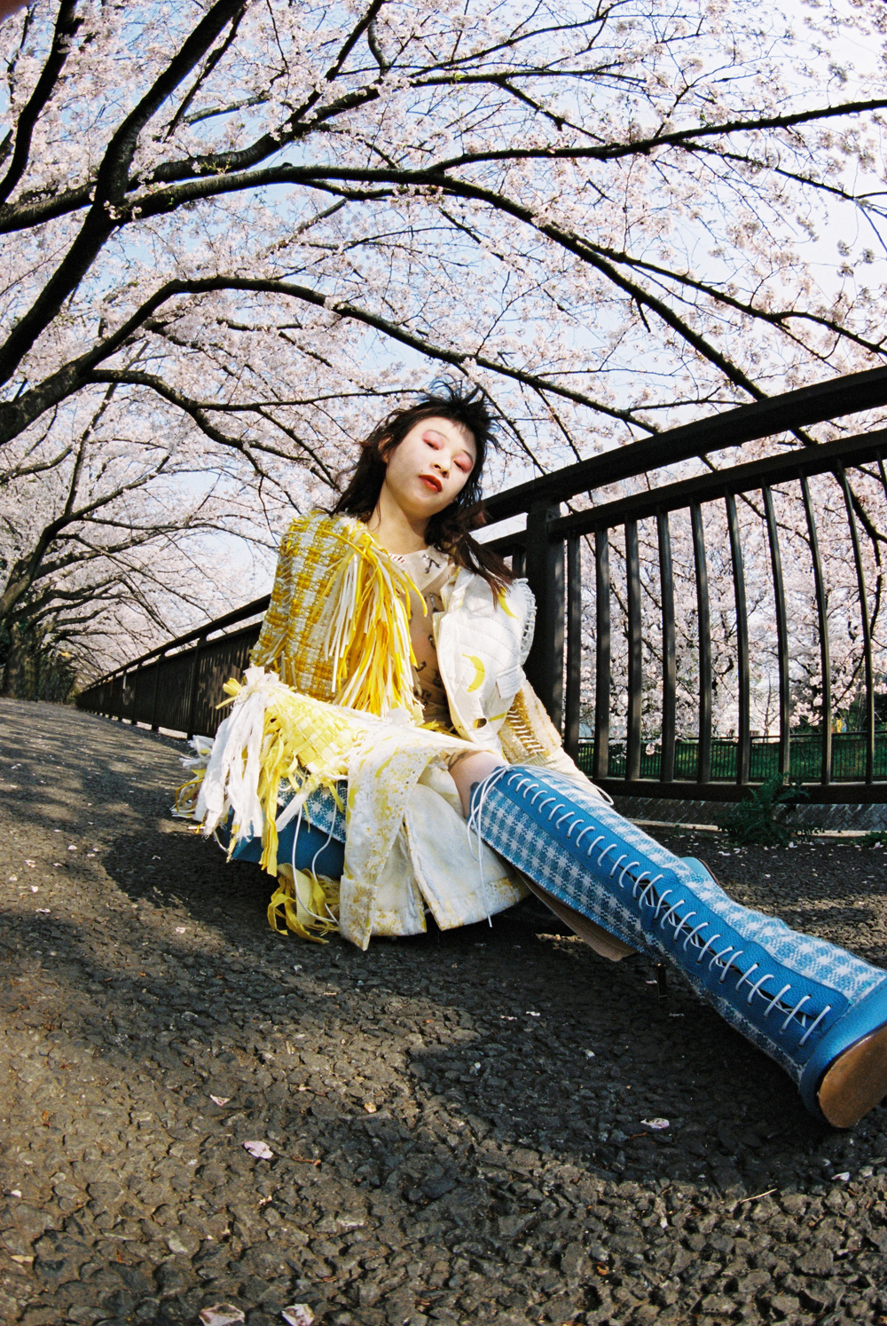 Jacket, top, skirt, and boots by THOM BROWNE