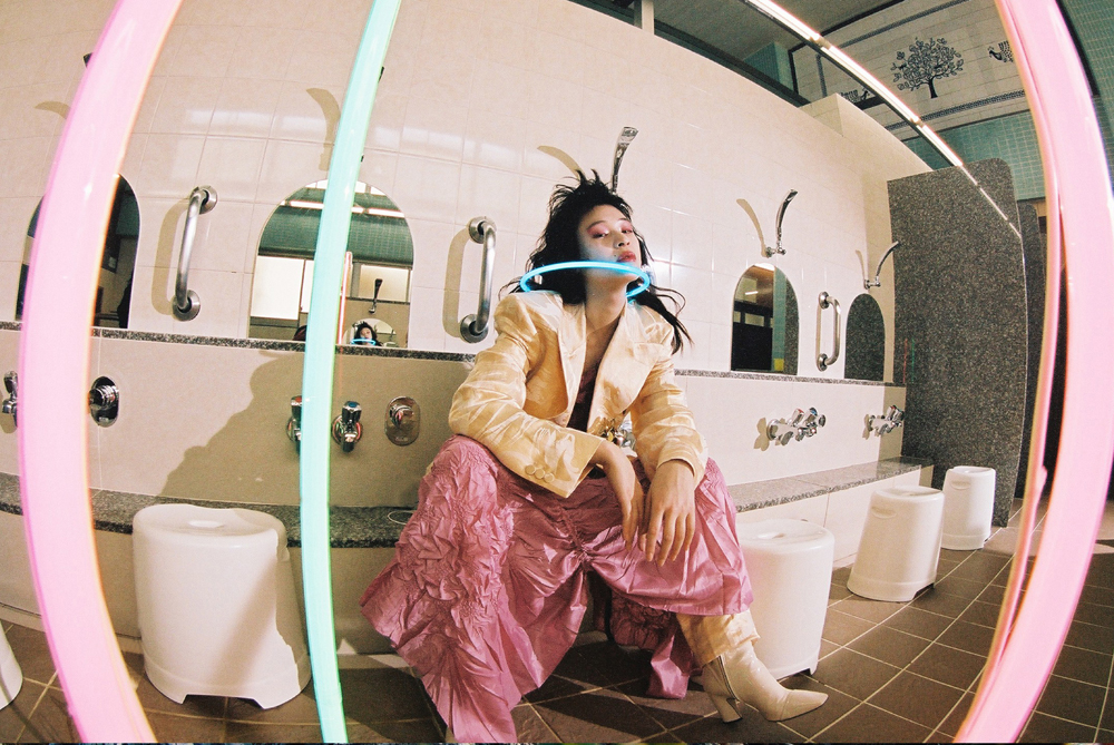 Jacket and pants by ACNE STUDIOS, shirt by CHIKA KISADA, boots by JIMMY CHOO